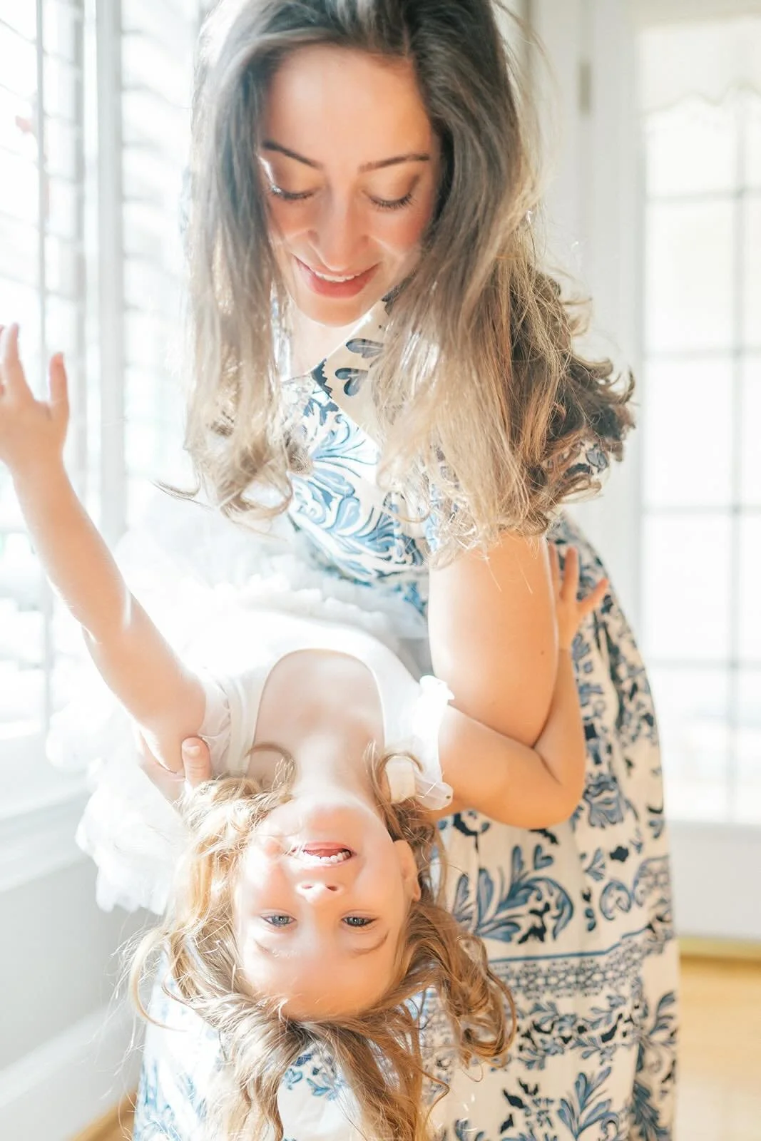 Mom holding daughter - Raleigh Newborn Photographer
