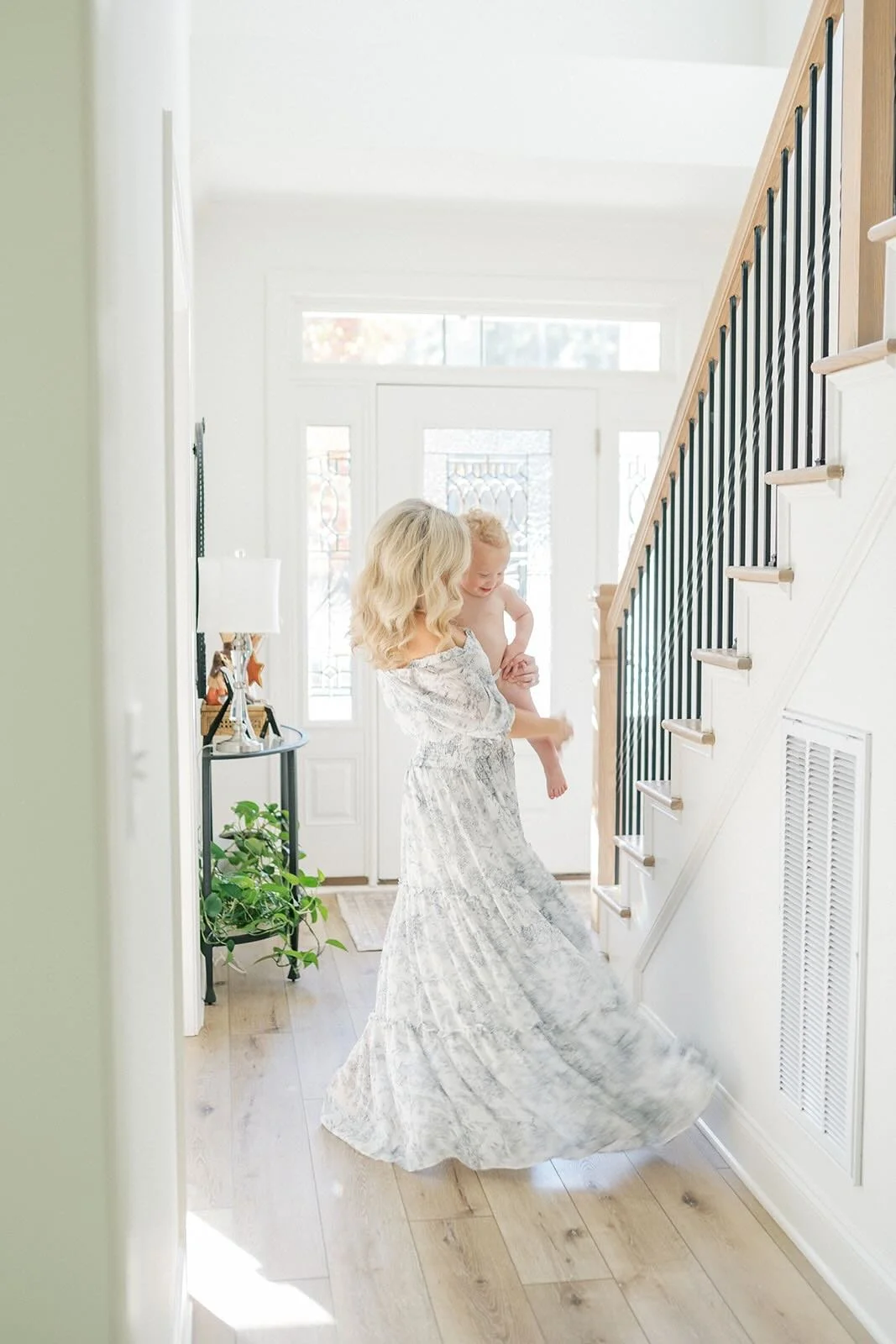 Mother twirling with child - Raleigh Newborn Photographer