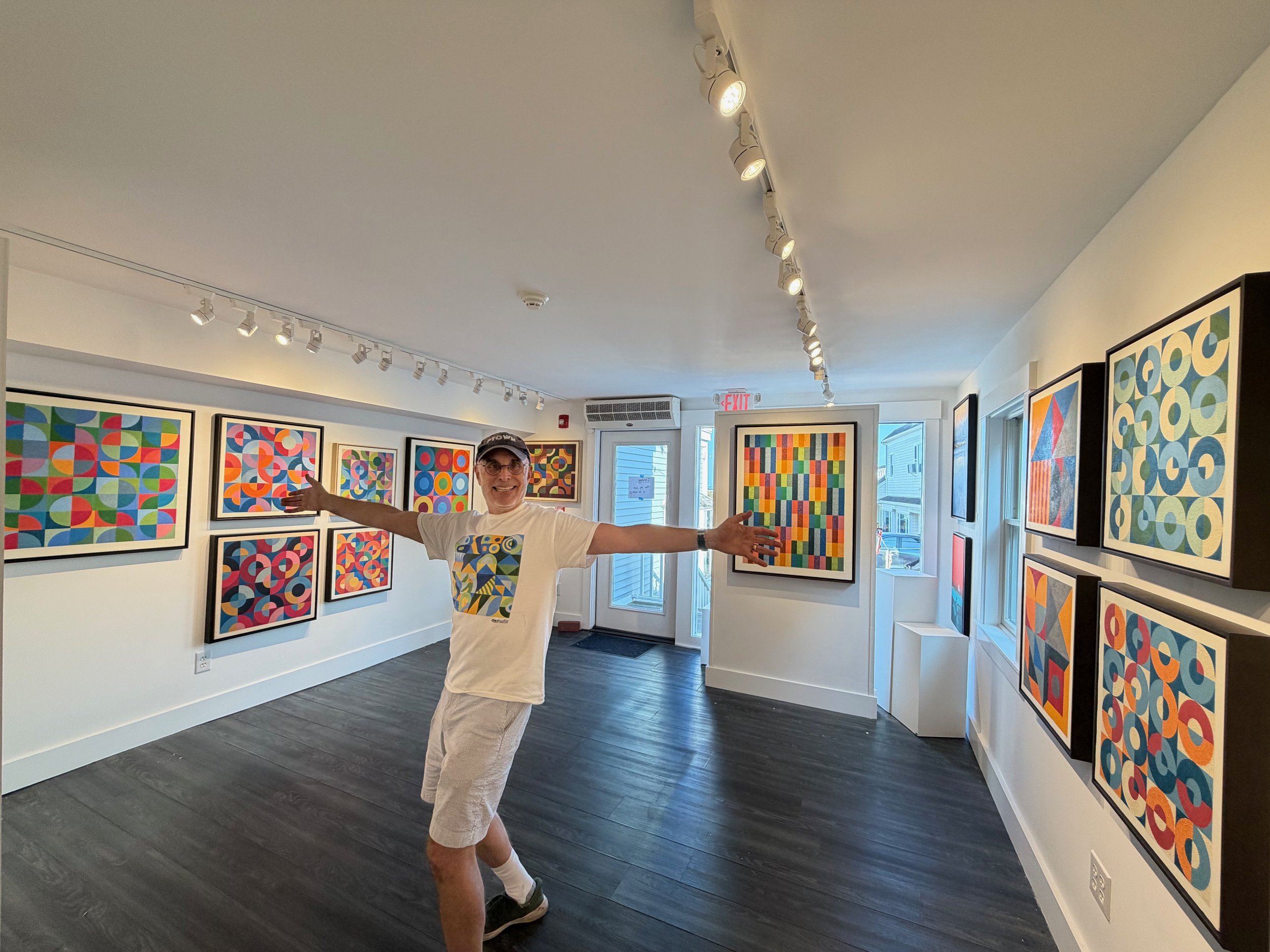 Exhibition of Ross Ozer's colorful geometric encaustic paintings at Ali Gray Gallery in Provincetown, Massachusetts, during his 2026 solo show.