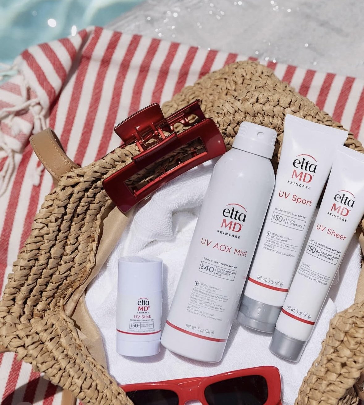 Set of skincare products, including syringes, bottles, and containers, with black and silver packaging, labeled EXO | E and D|TOX, RE|PAIR, DELIVE, and DE|RIVE.