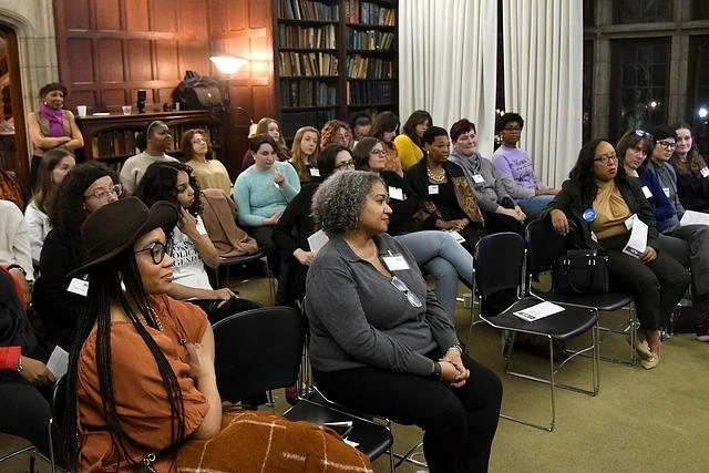 Photo of the Ready to Run 2023 participants, seated and listening to speakers off screen