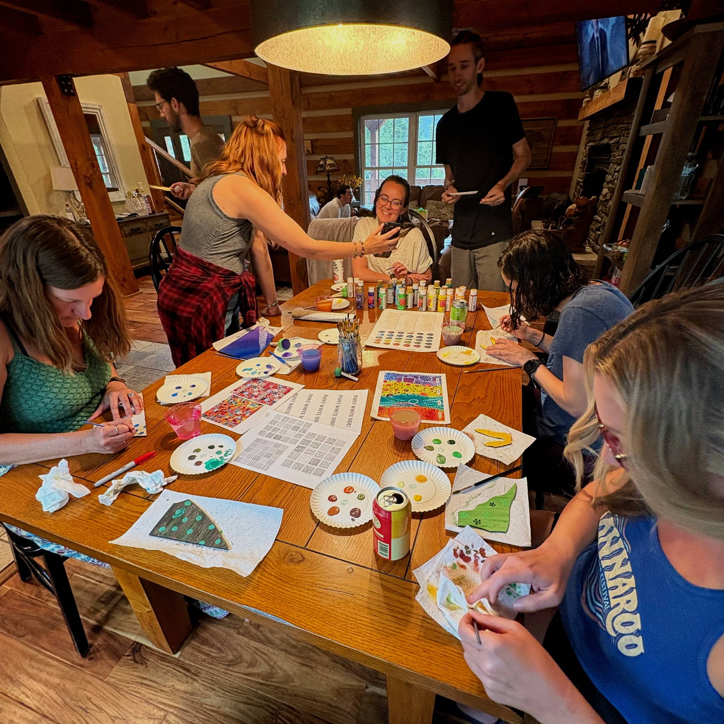 A group of friends painting puzzle pieces together