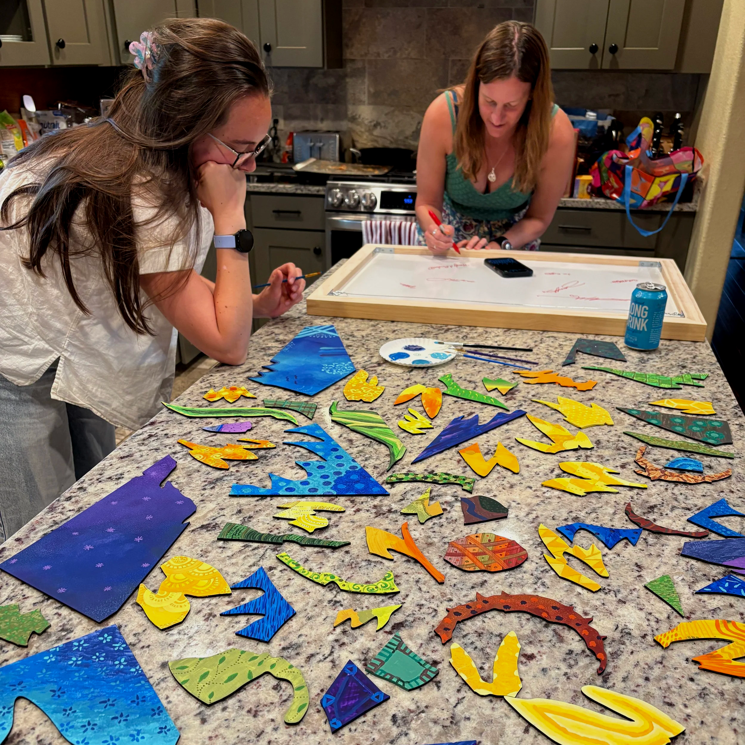 Colorful painted puzzle pieces on a countertop