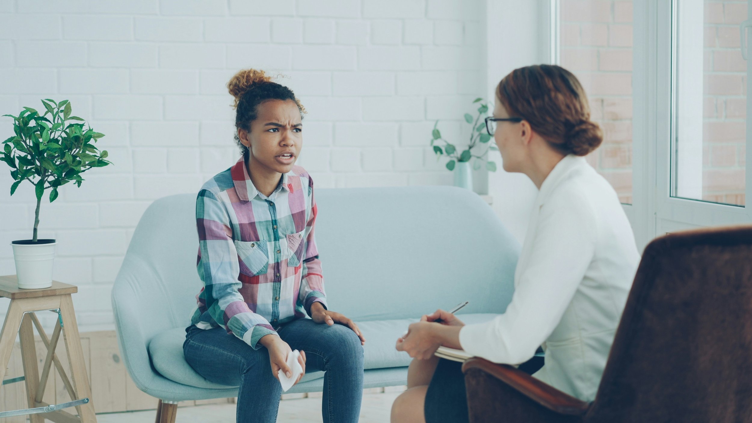 A psychiatrist conducting a patient consultation at an integrative mental health clinic in San Francisco California
