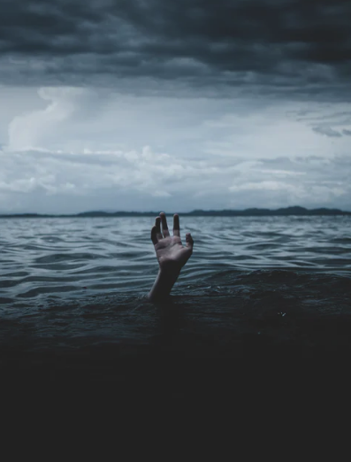 Hand coming out of water.png