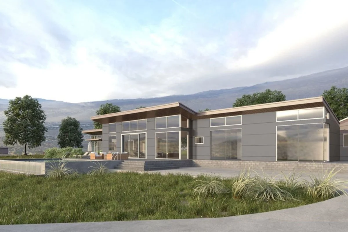 Modern house with large glass windows, surrounded by greenery and trees, with a mountain in the background.