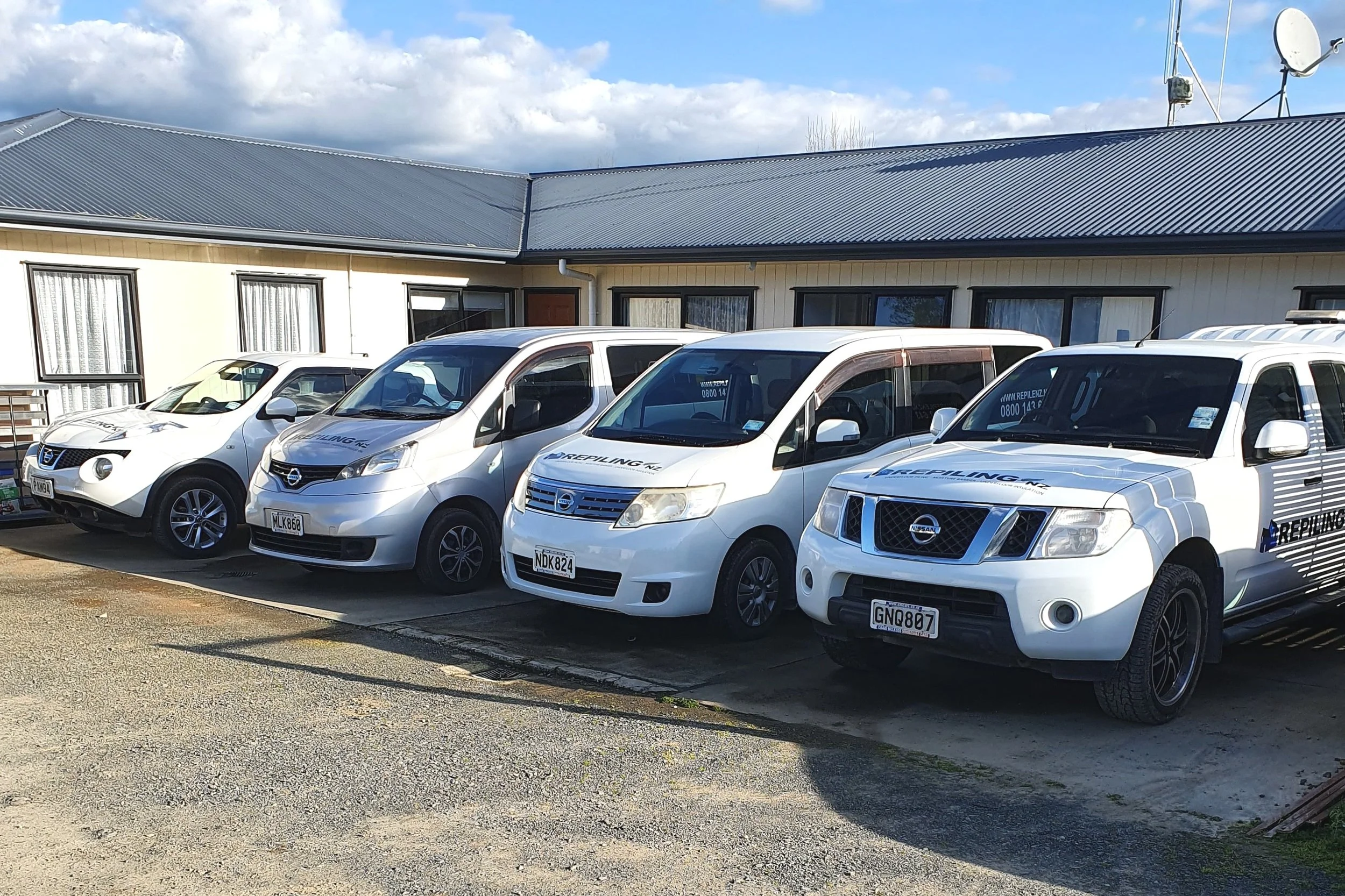 Oranssi technician working on a roof project