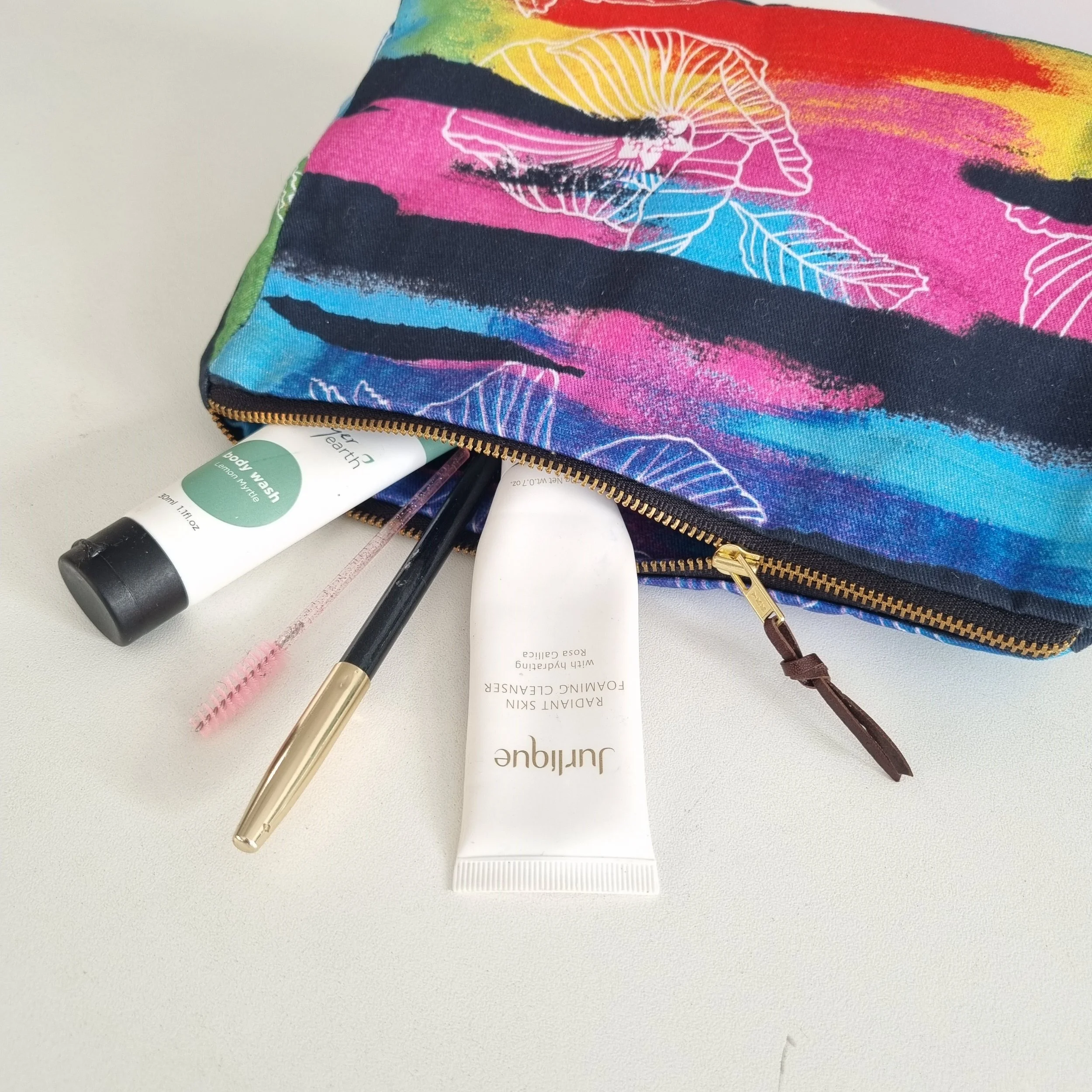 Kistima-MenserM-YOUAREBRAVETEXTILES_RainbowHibiscusToiletryBag_2025_PhotoByKistima-MenserM.jpg