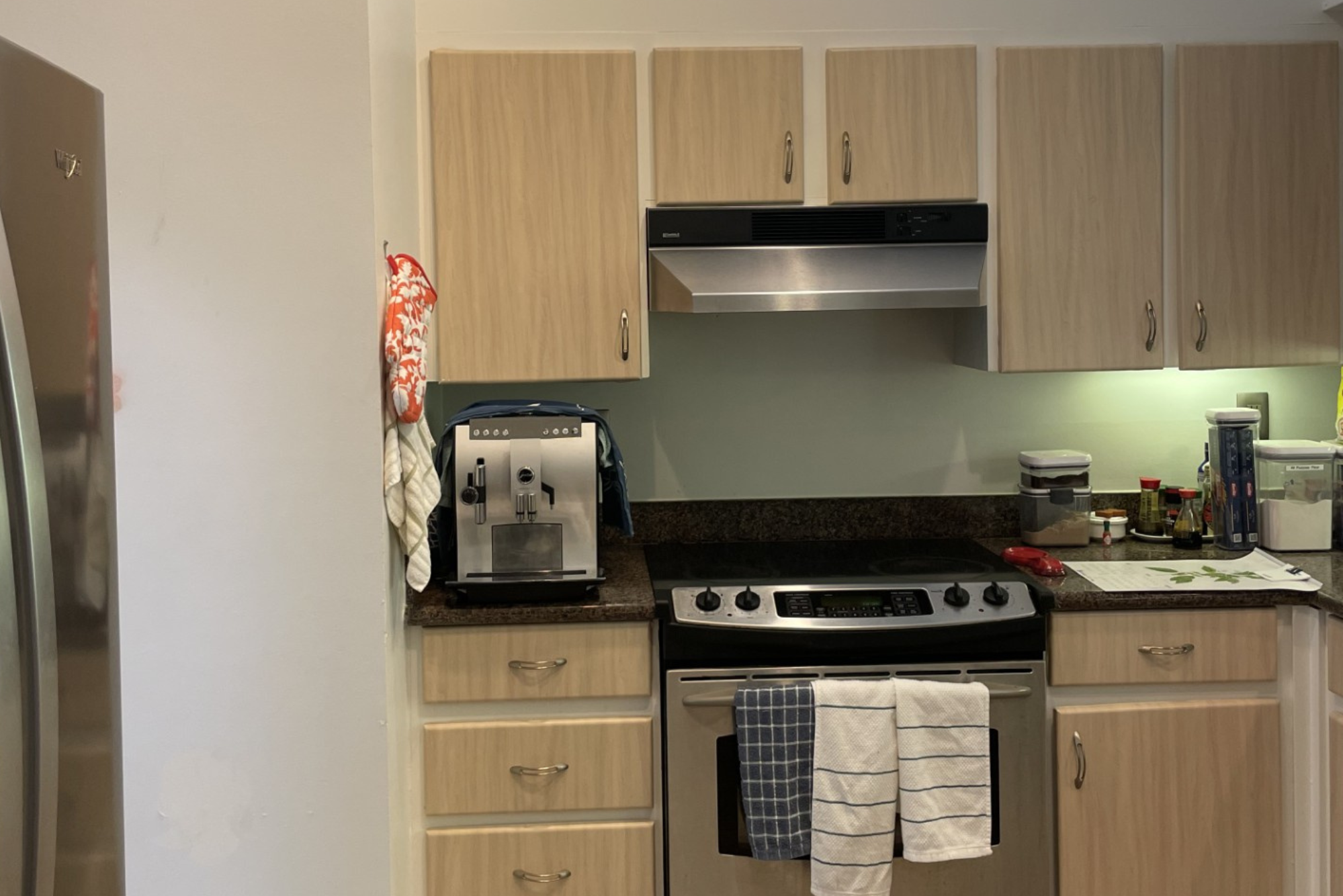 Before Image of a dark kitchen with light wood cabinets