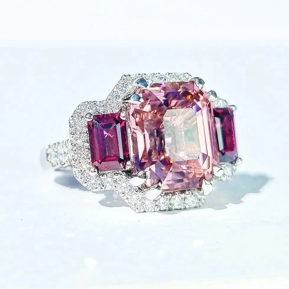 AVAILABLE! Dm for pricing and details on this charming piece. A stunning cocktail ring in our signature trilogy style showcasing a uniquely coloured 6.1ct pink tourmaline from Rwanda paired with red wine rhodolite garnets. Such a delicate pairing and