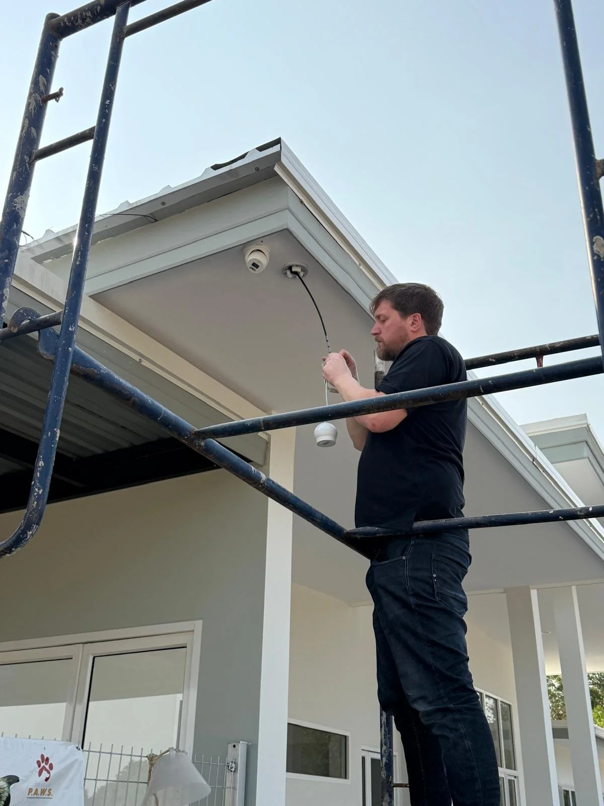 Intrepid engineer installing new Serage CCTV camera at animal sanctuary Thailand