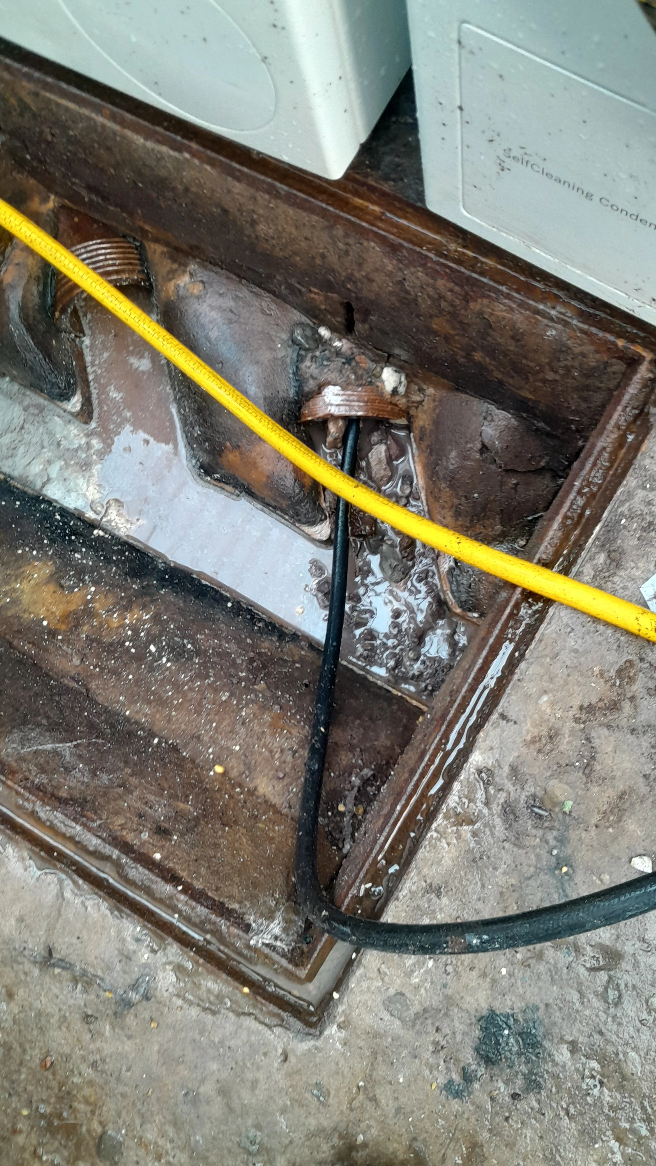 Drain clearance by jetting is being carried out to unblock a toilet