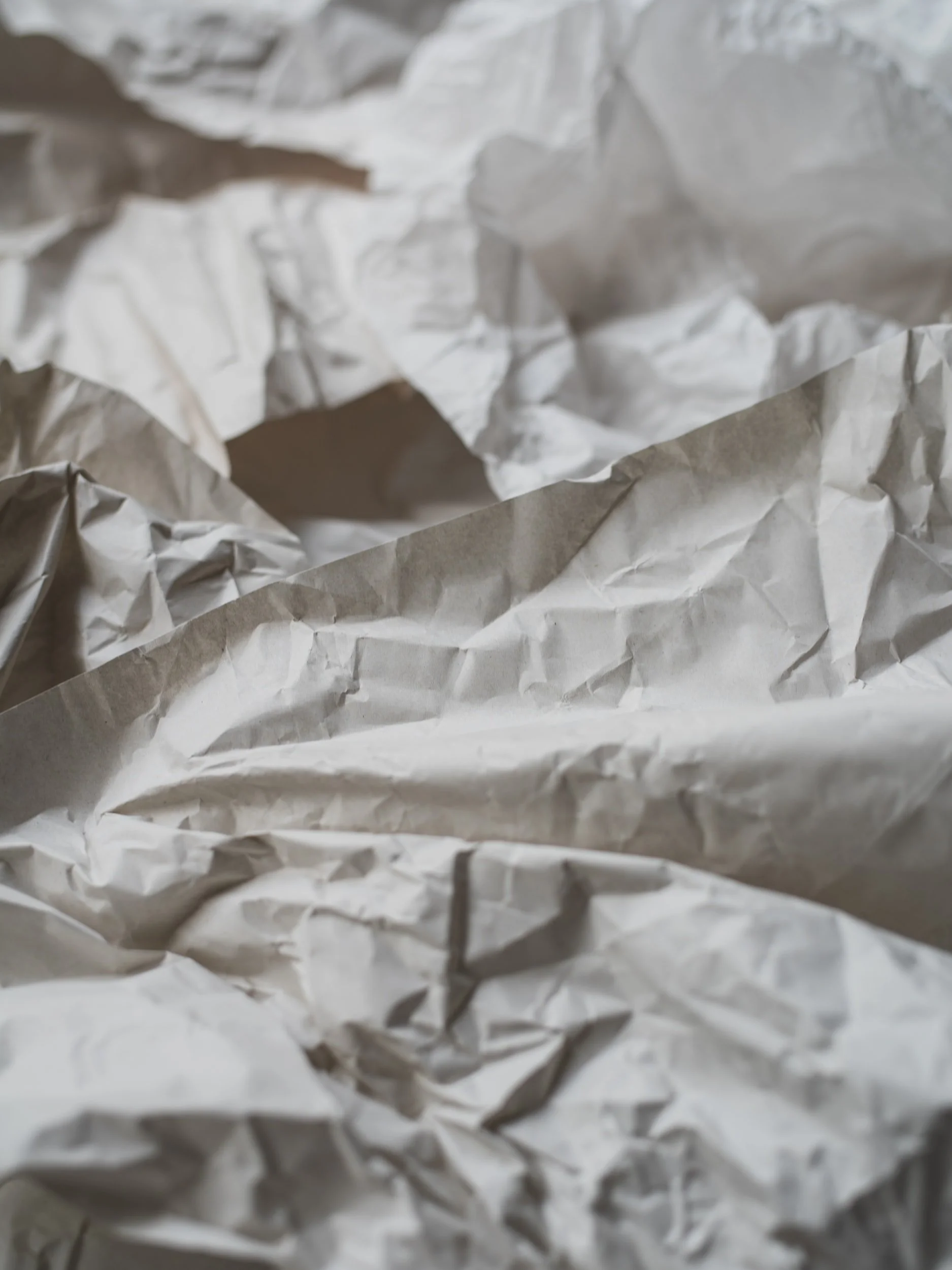 Close-up of crumpled white paper.