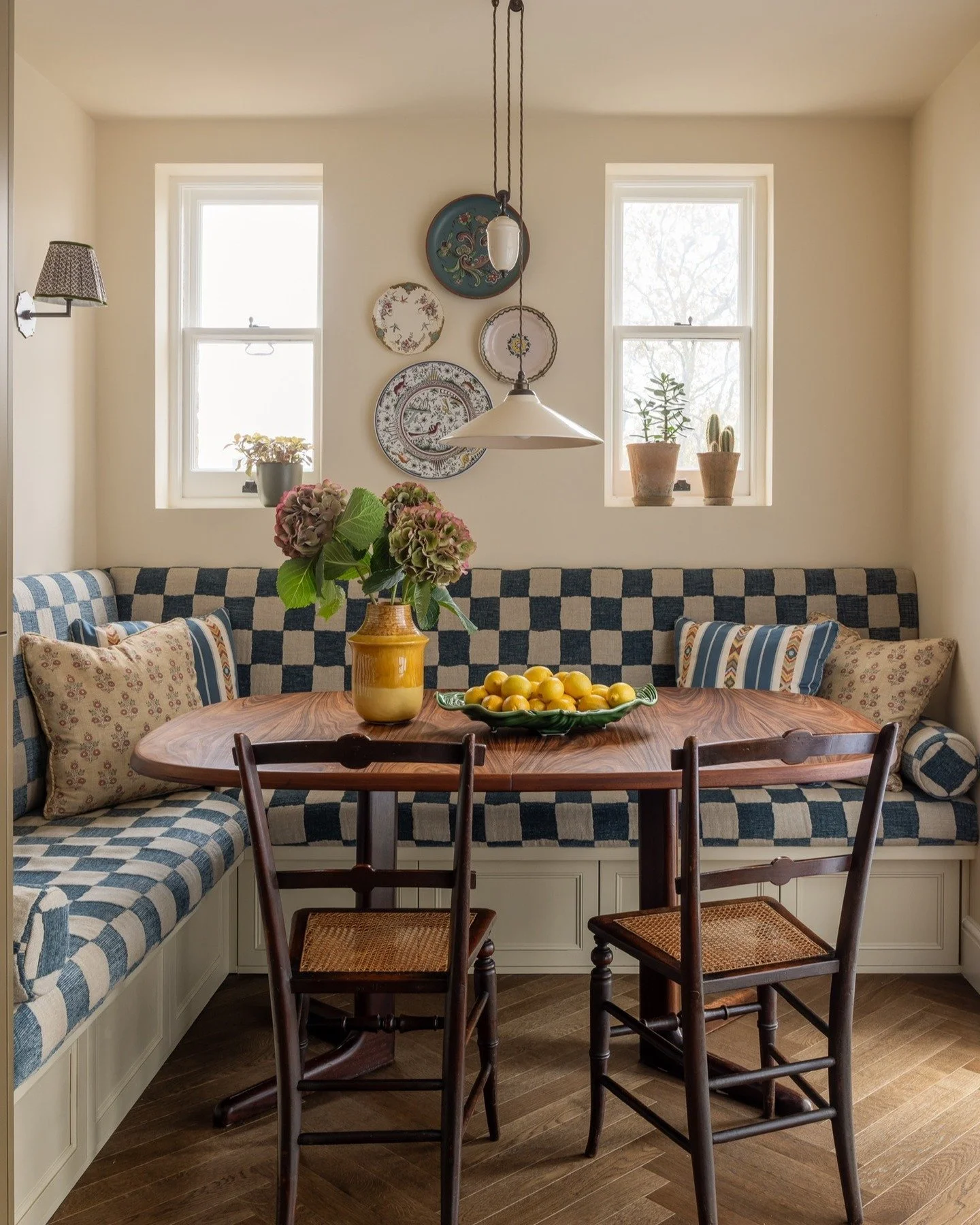 Swipe left for Before &amp; After

Our kitchen was designed to feel lived-in, warm and in keeping with the character of the flat.

The banquette became the heart of the room, creating a dining area that naturally draws everyone in.

We chose a light 