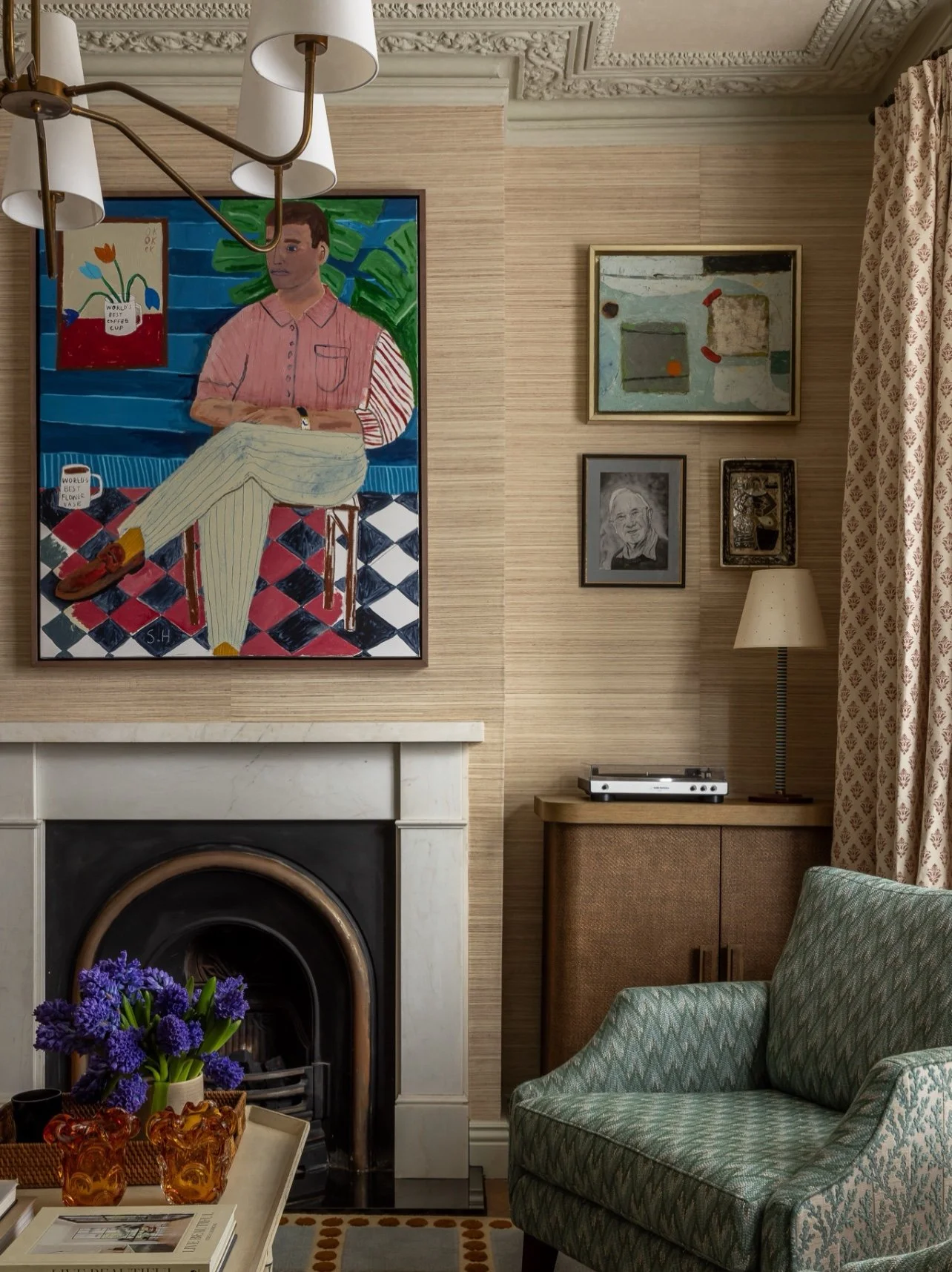 For this project, the brief was not to create a room that felt overly formal or untouchable, but a happy living space with character, comfort and a sense of life already being lived.

We introduced texture through the grasscloth wallcovering, warmth 