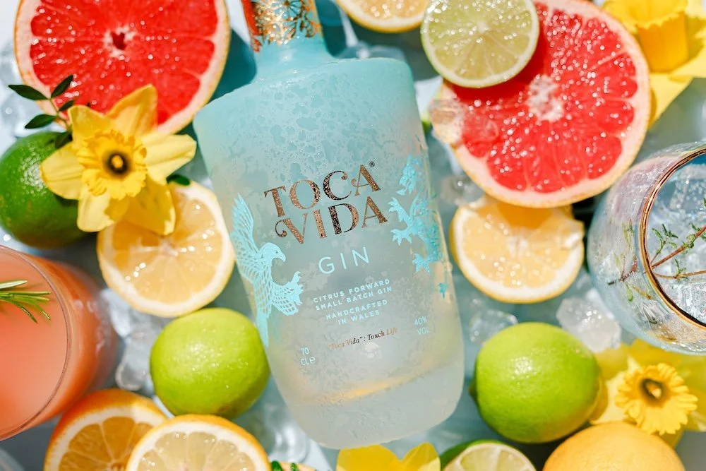 Toca Vida Welsh craft gin bottle styled with botanicals