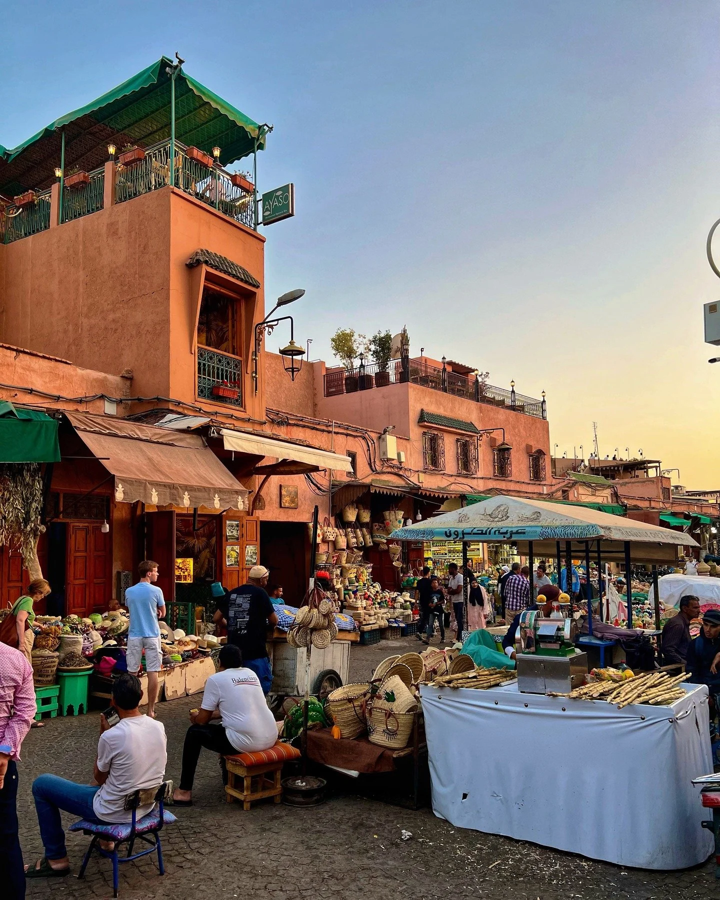 Marrakesh marketplace &amp; souk at dusk &amp; midday