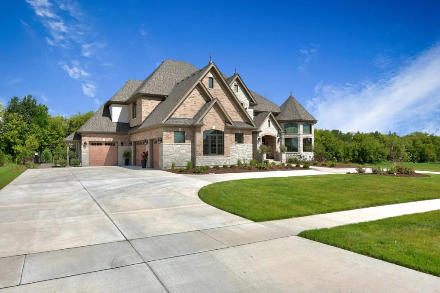 Landscape design with concrete driveway in Troy, MI