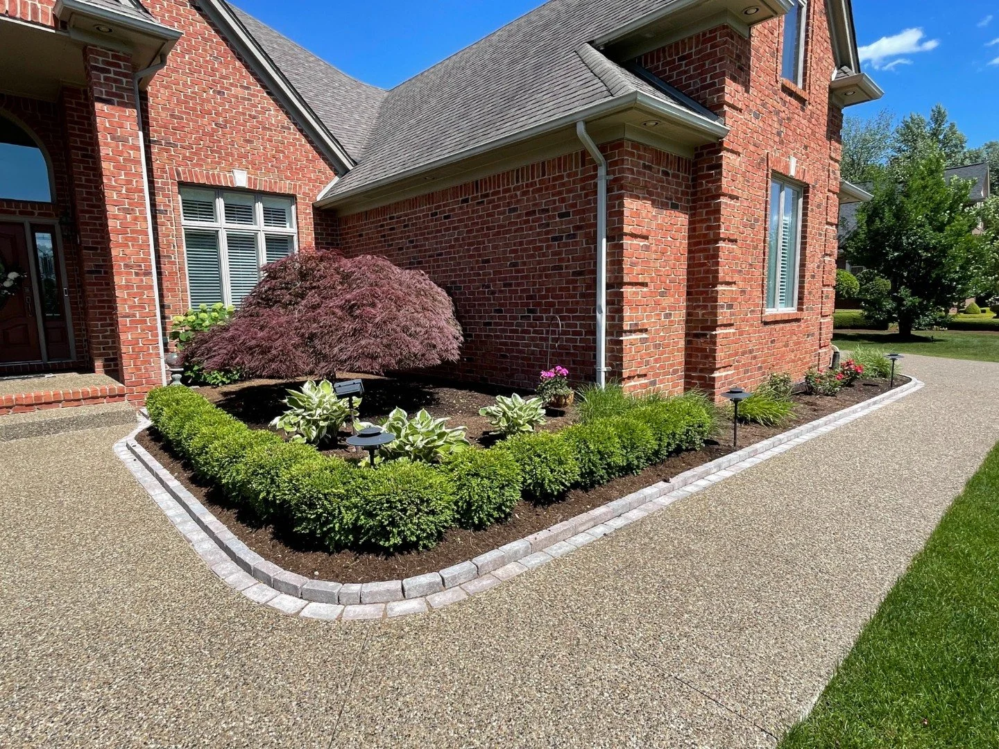 Concrete walkway and plantings in Oakland Charter Township, MI