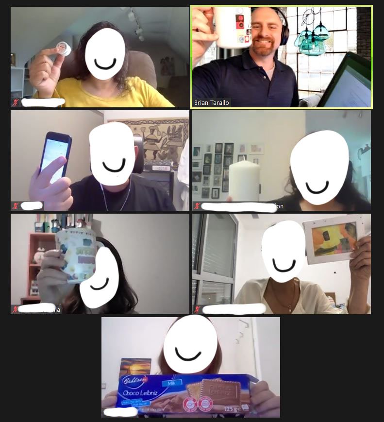 Zoom screenshot of participants holding objects up to the camera