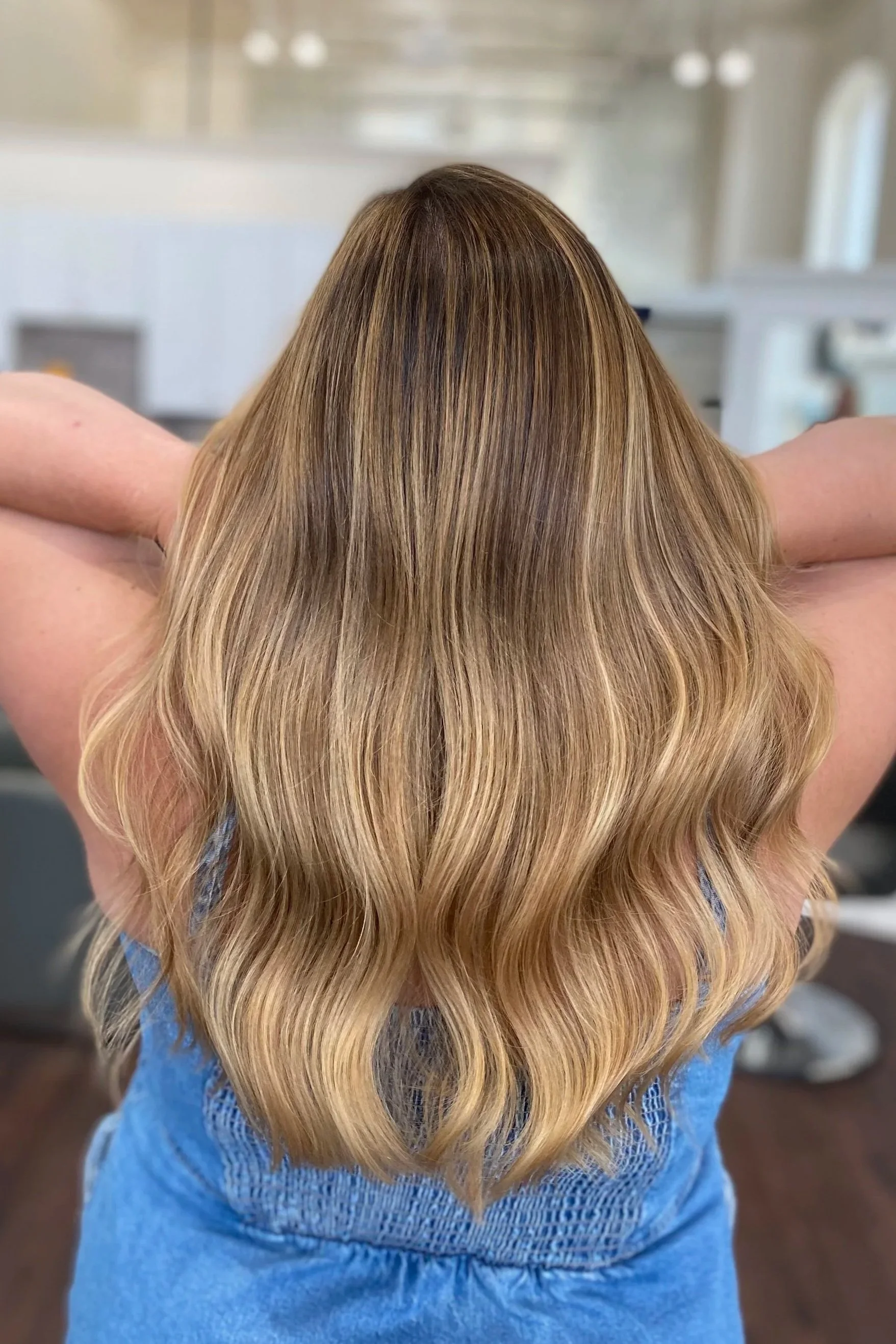 back of the head of light brown highlighted haired girl