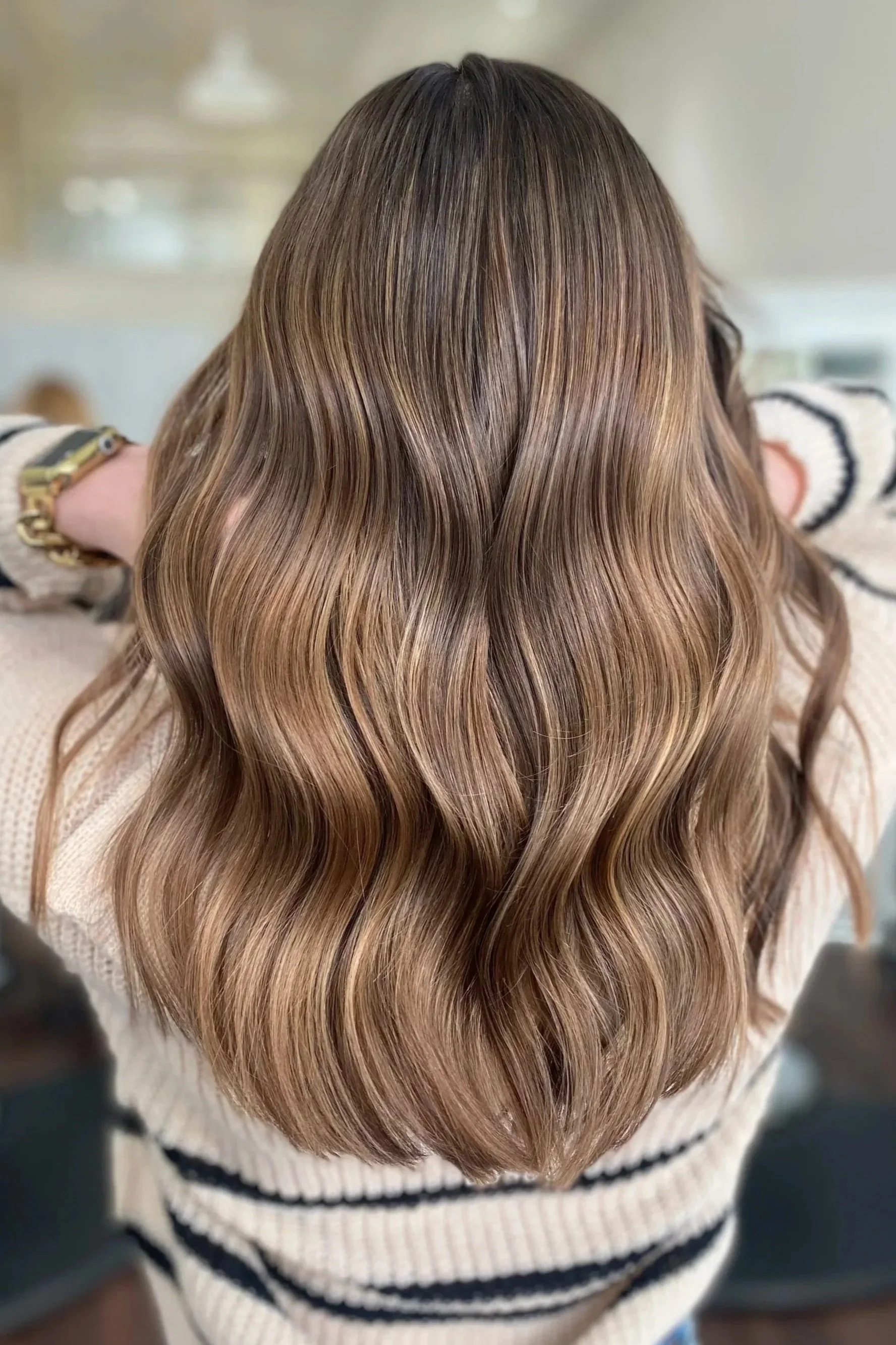 back of head of brown shiny haired girl