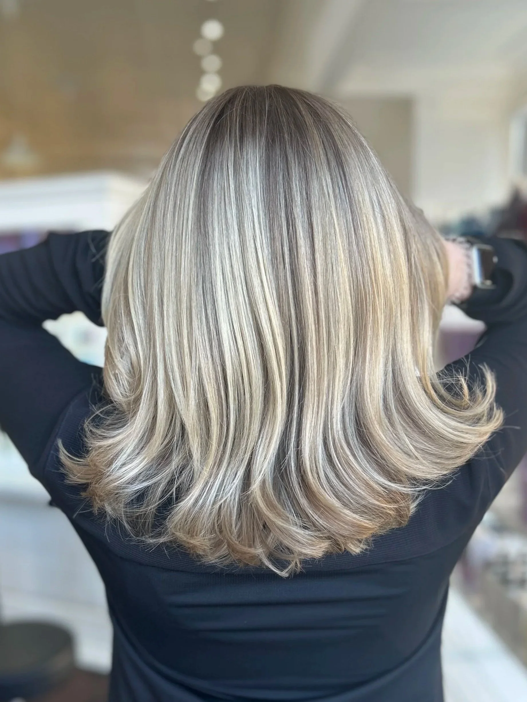 back of woman's head showing off beautiful blonde highlighted hair