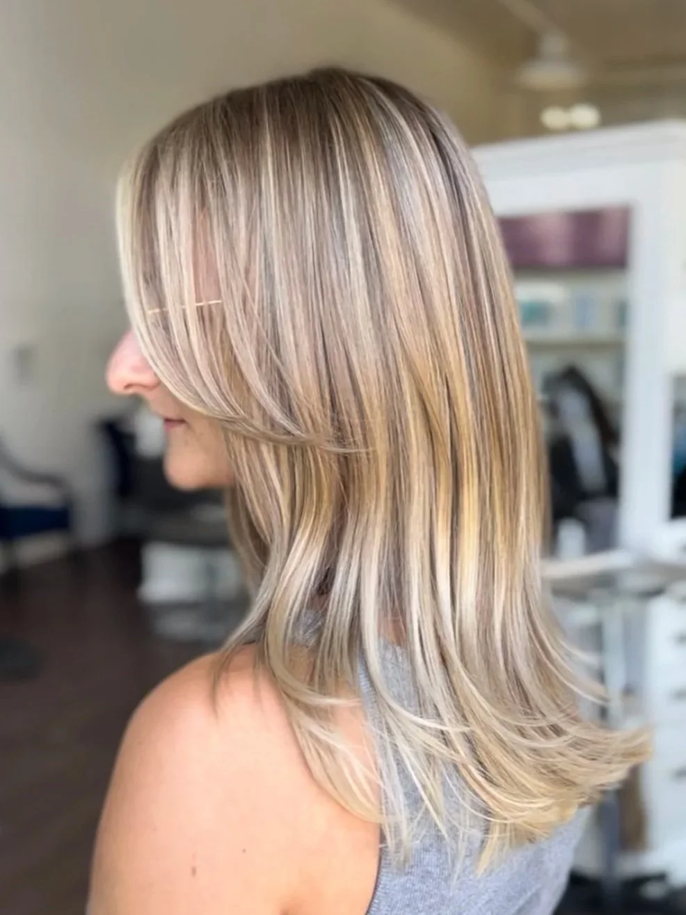 side profile view of woman with blonde highlighted hair