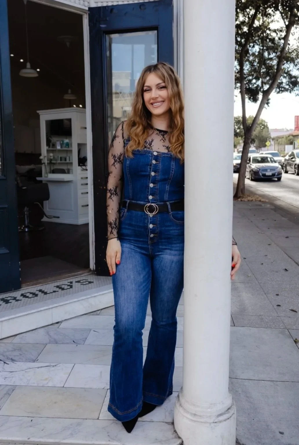 standing headshot of faith recchia outside hair salon