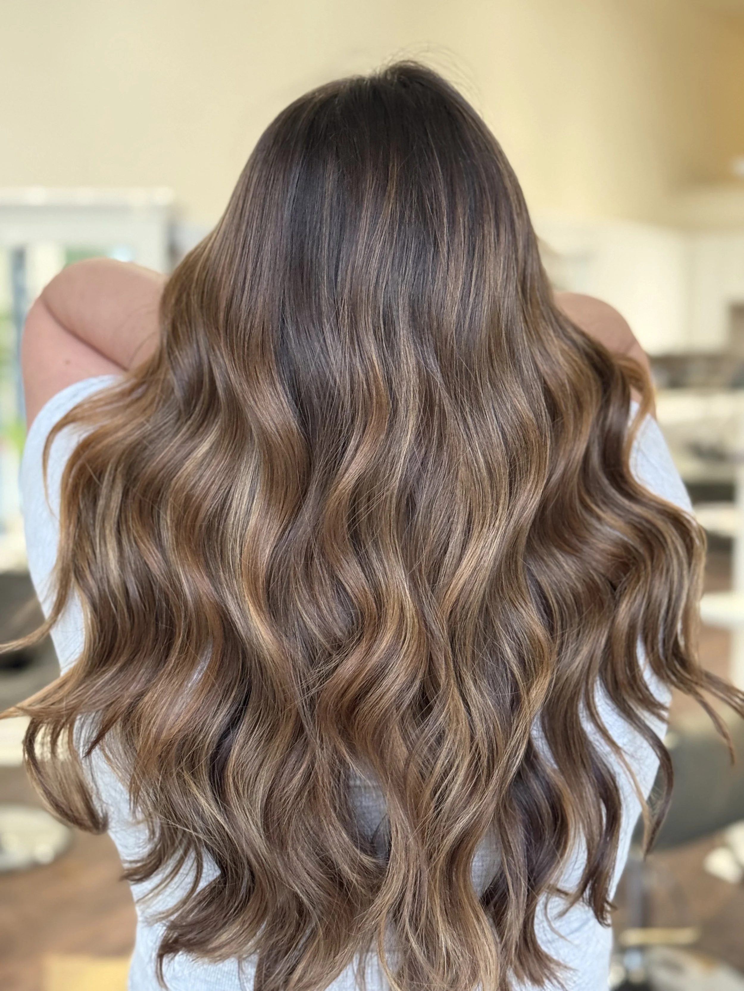 back of the head of long haired brunette girl