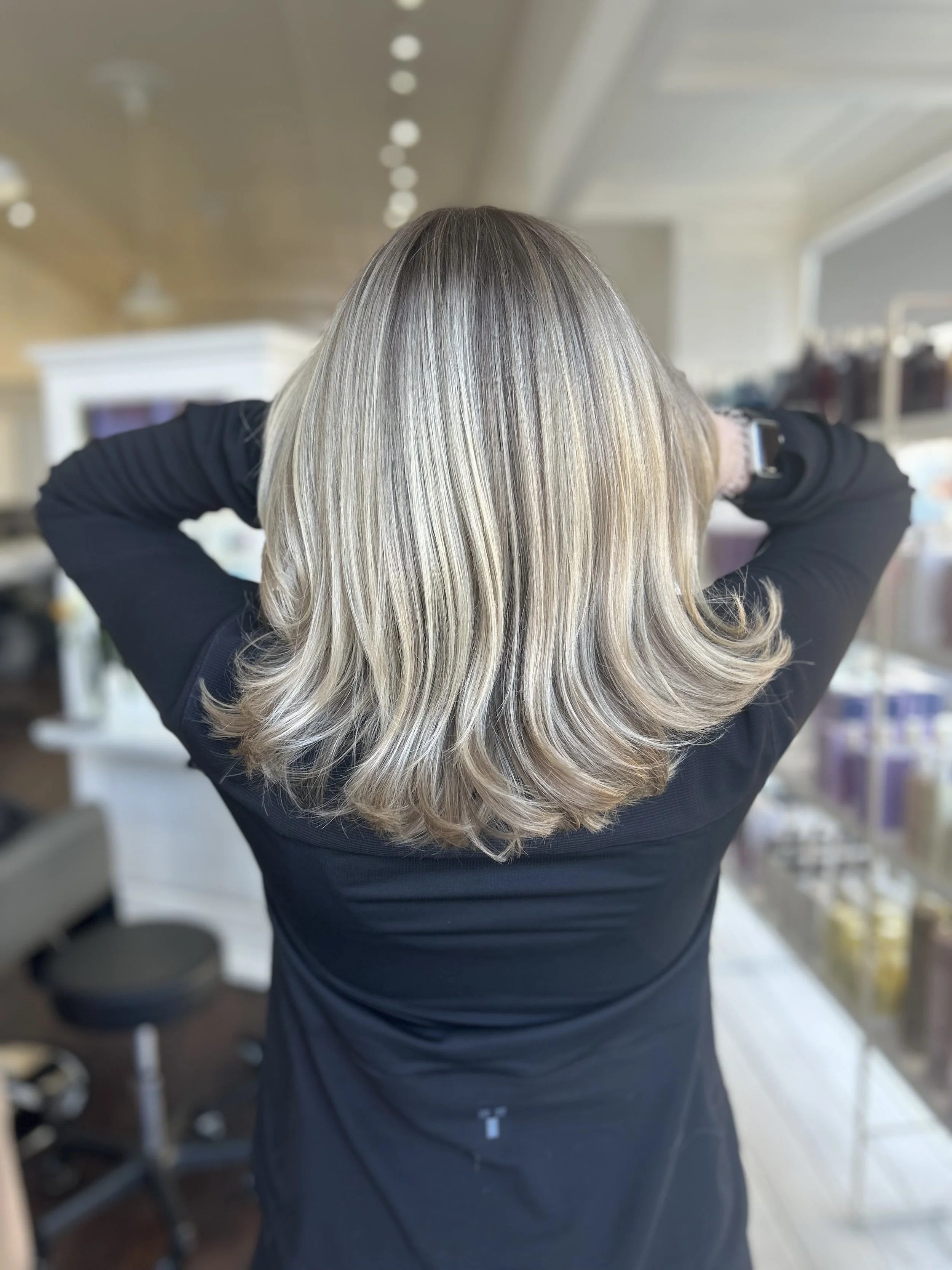 back of woman's head showing off beautiful blonde highlighted hair