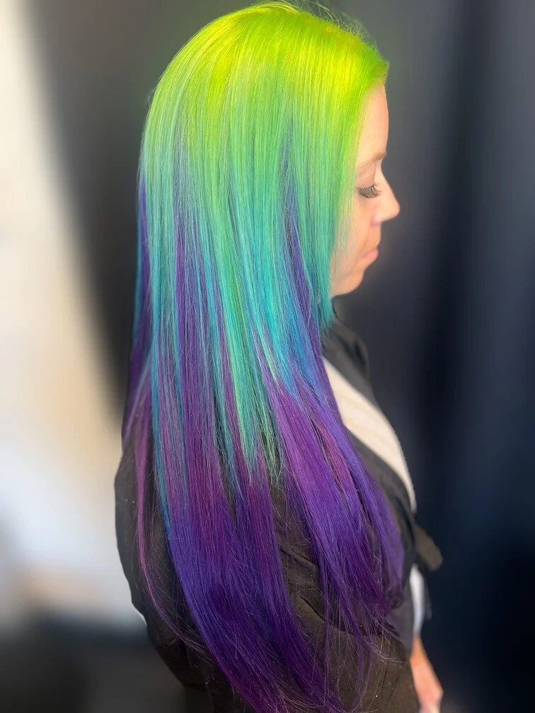 woman with bright green and purple hair
