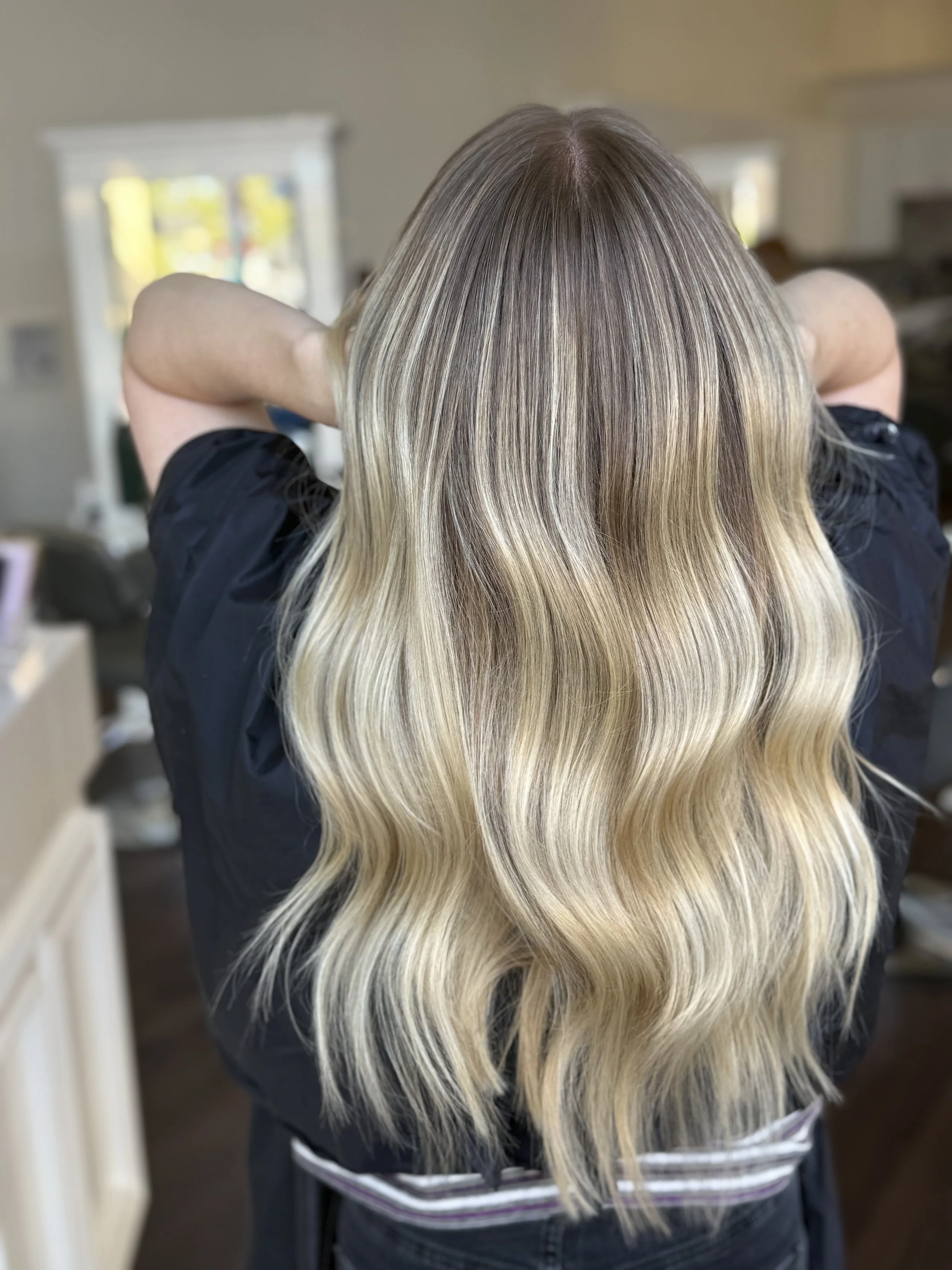 back of head of blonde haired girl