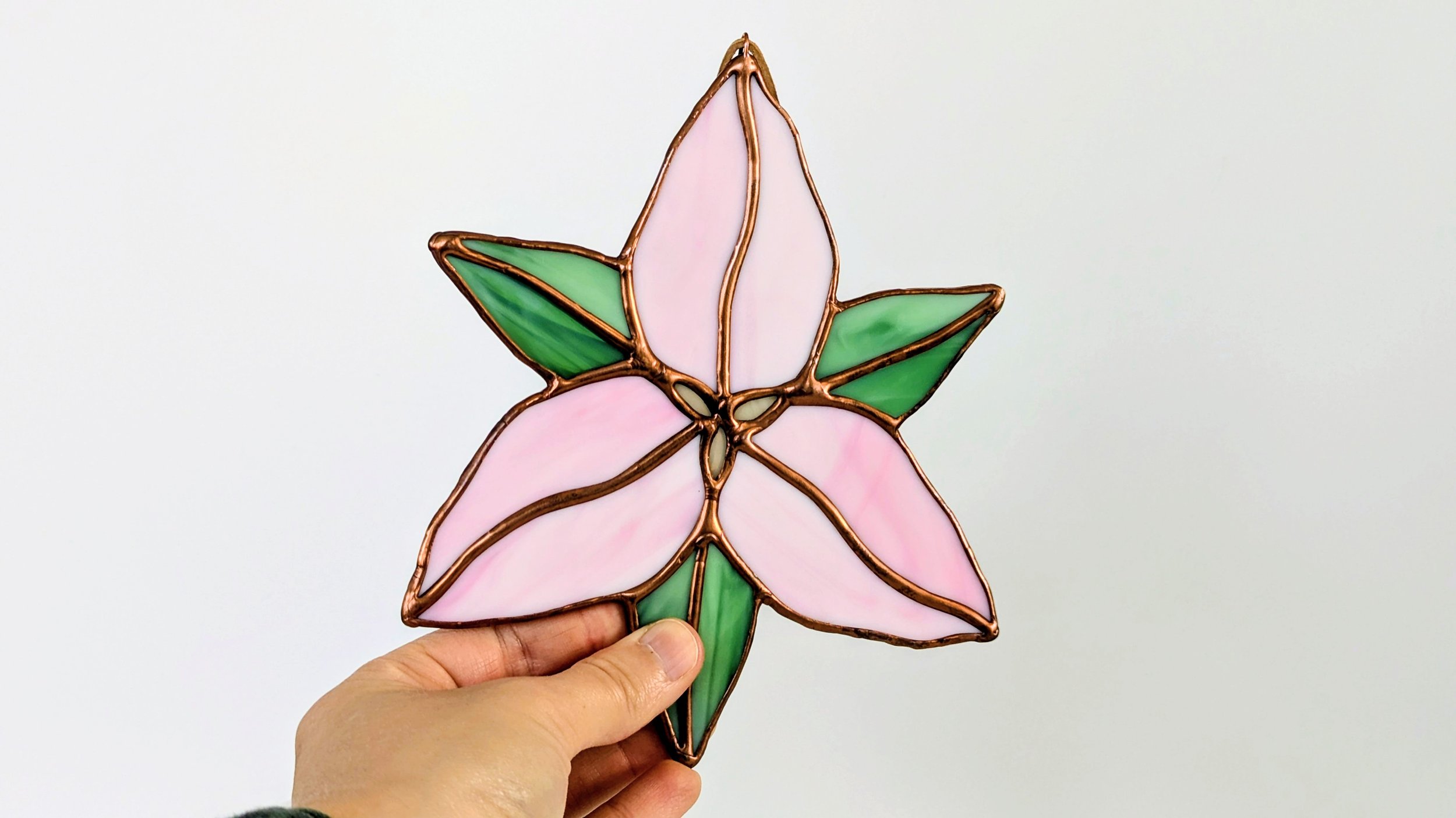 trillium pink hand horizontal.jpg