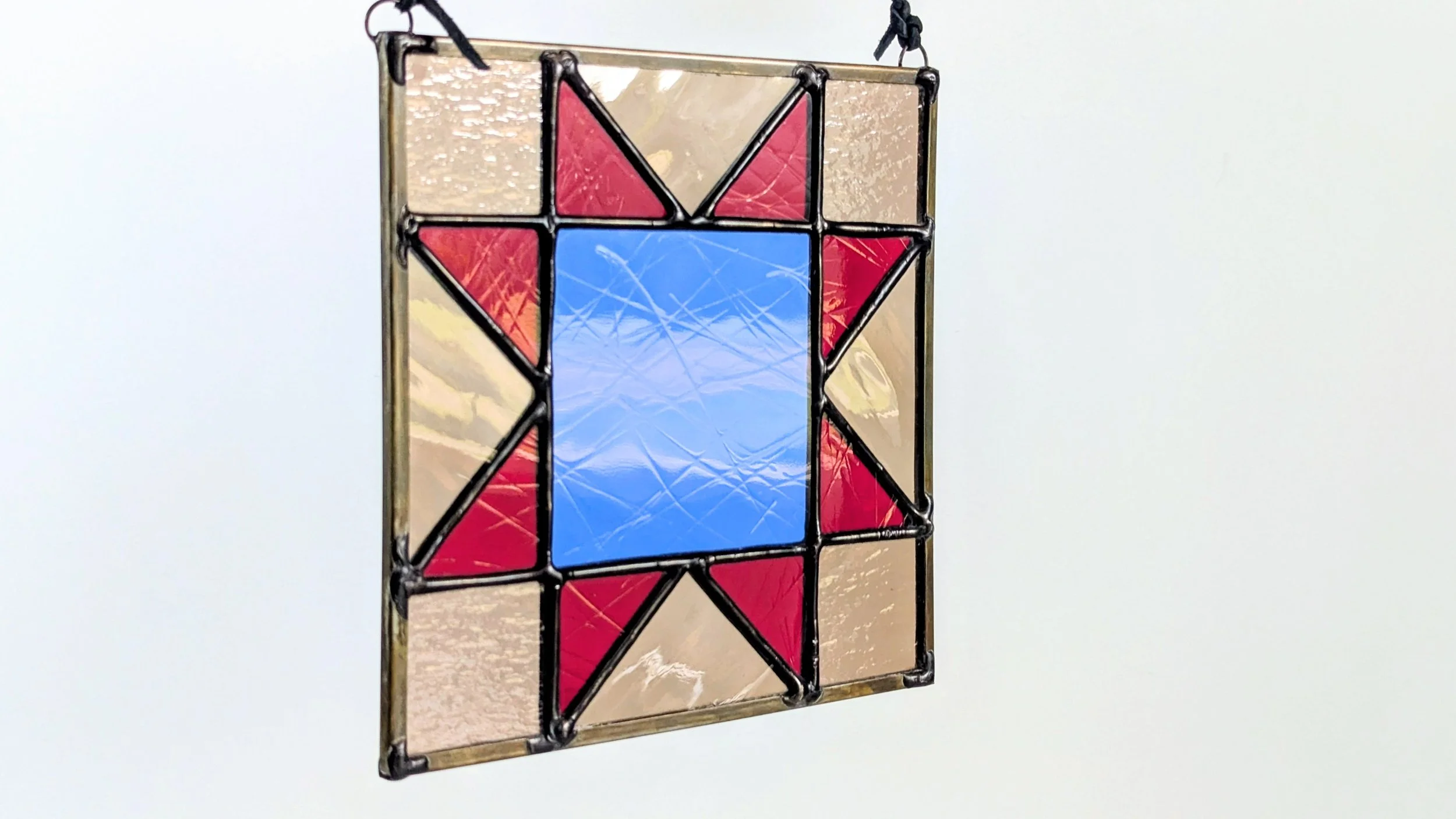blue red quilt hanging texture horizontal.jpg