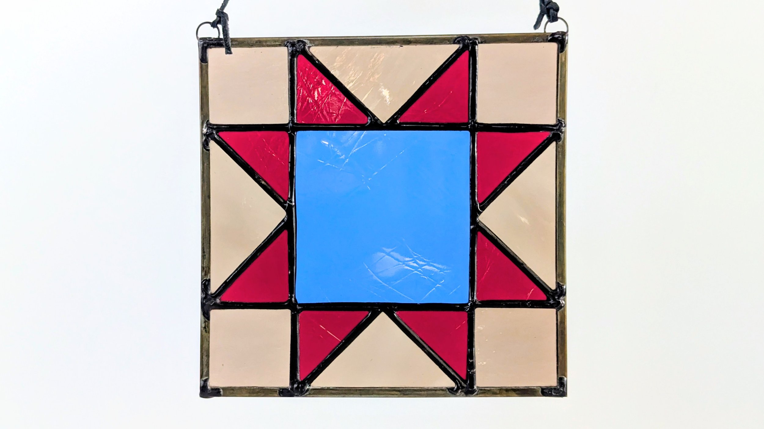 blue red quilt hanging horizontal.jpg