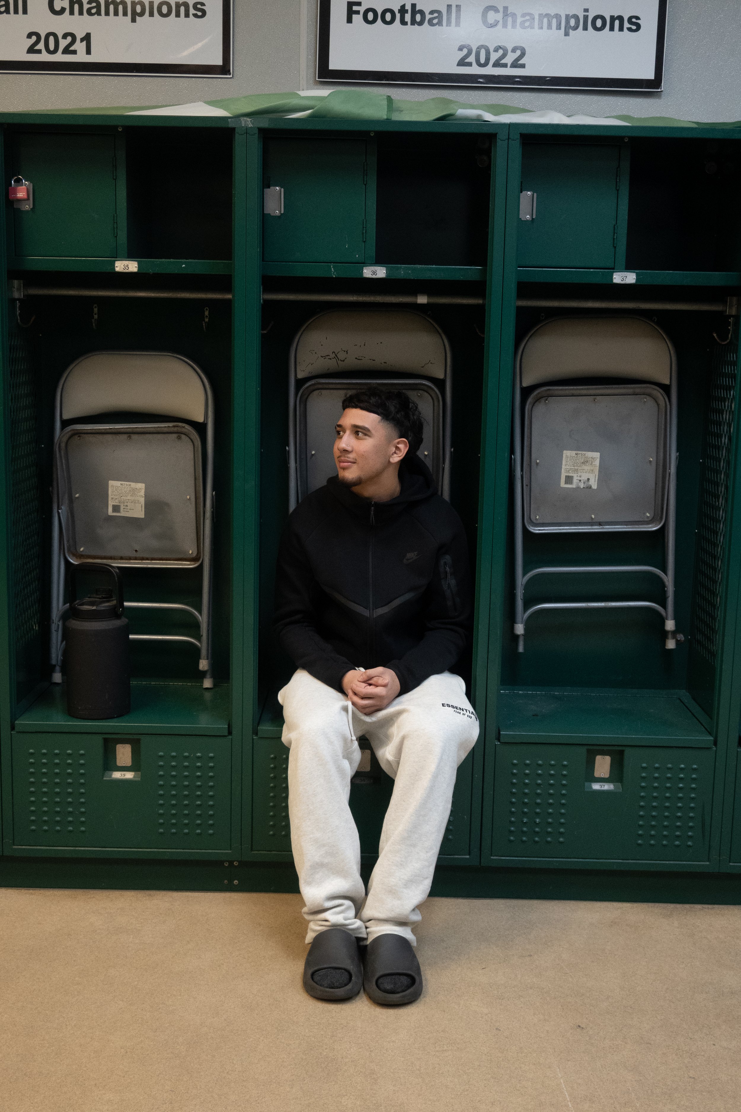  Jose Rios sitting in his old locker reminiscing of important memories in his life. This picture was taken at the Walker Vick Field house in Manteca, California on Feb. 4, 2026. (Raul Figueroa/The Tower)&nbsp; 