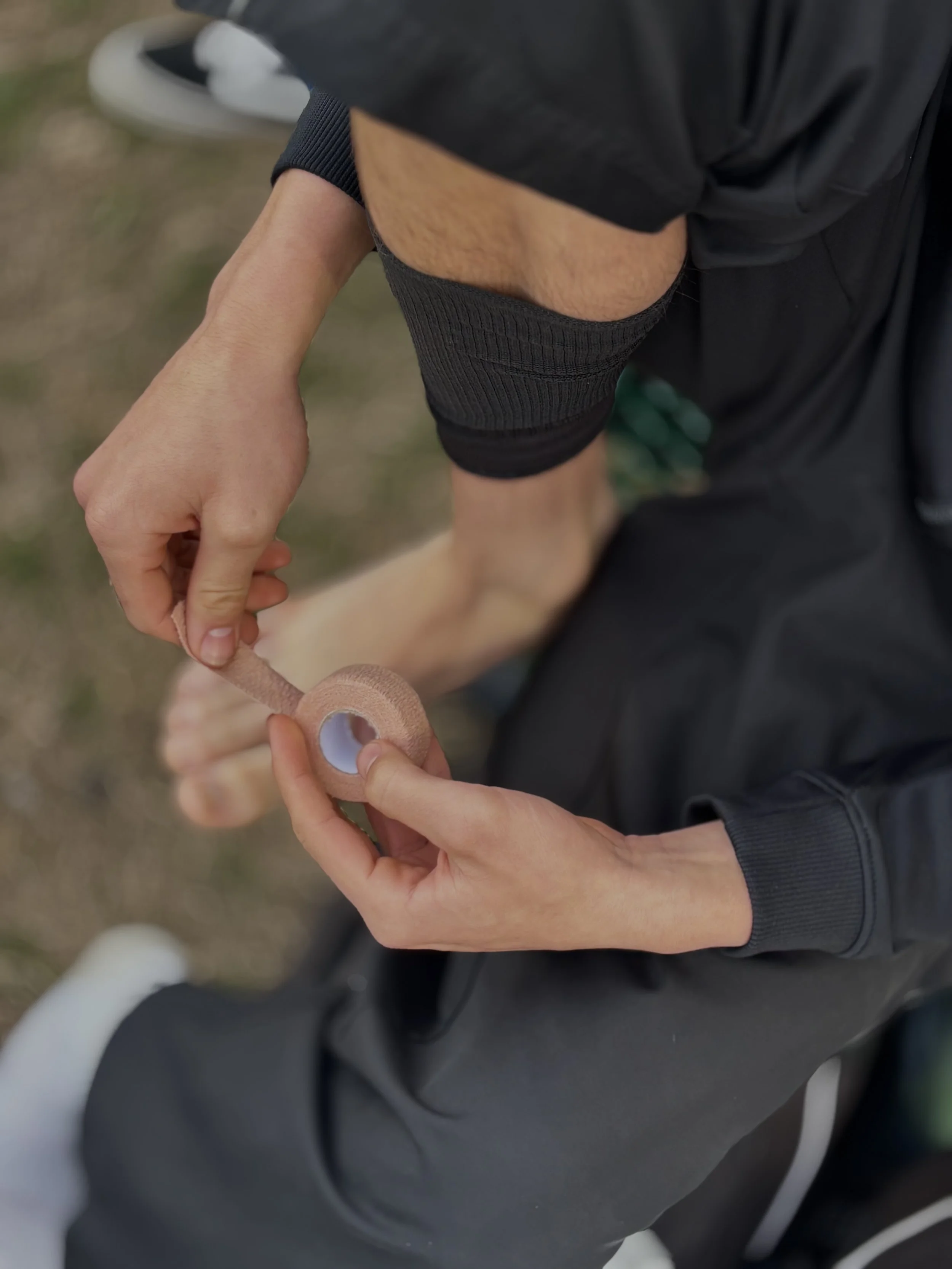  Mateo Esparza putting on pre-wrap on his toe before an important game, senior night. Against Mountain House, February 5, 2026. (Christian Ambriz/The Tower) 