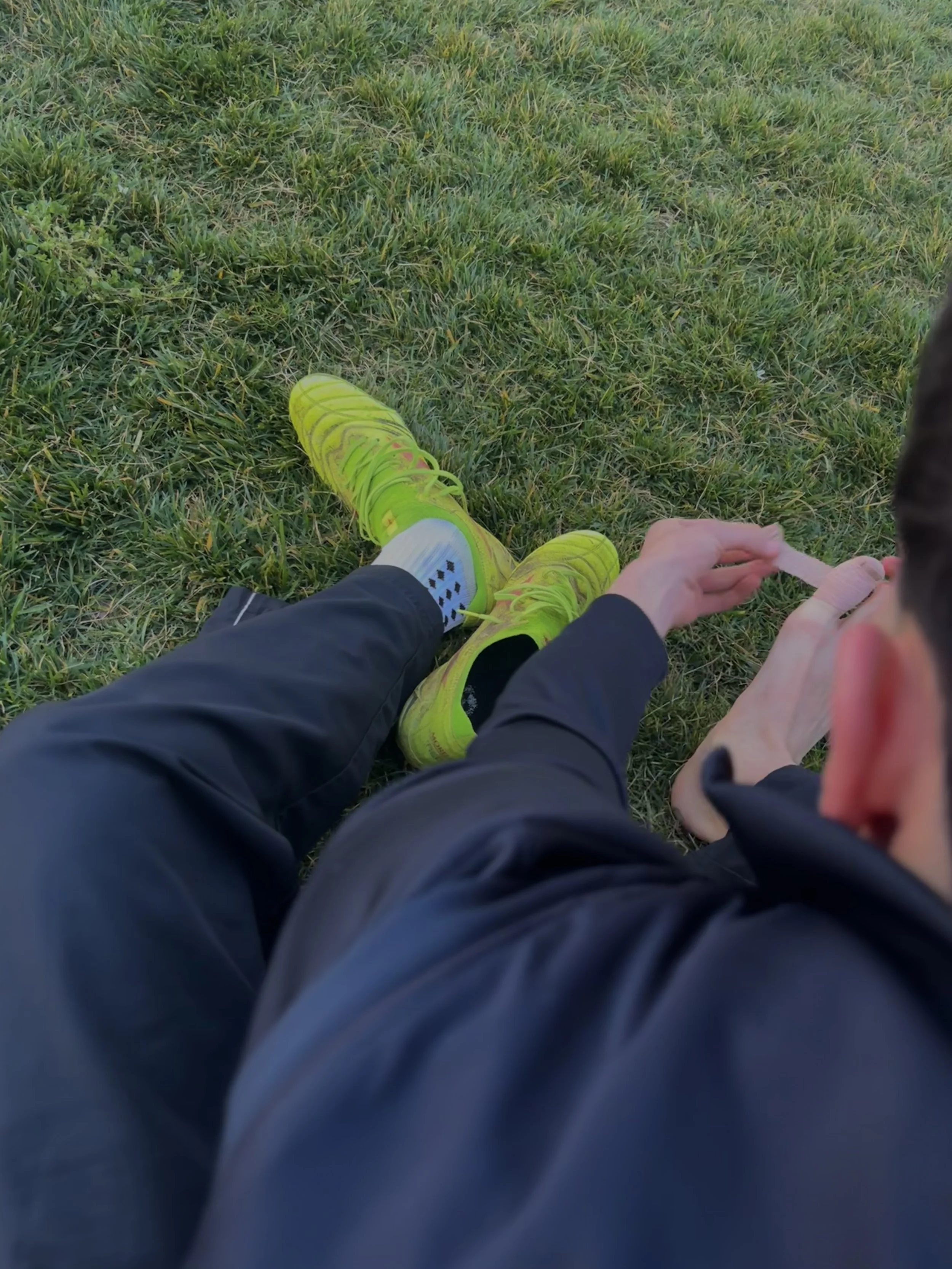  Mateo Esparza putting on his pre wrap again during warm-ups because it had fallen off, in a game before mountain house for senior night, February 5, 2026. (Christian Ambriz/The Tower)&nbsp; 