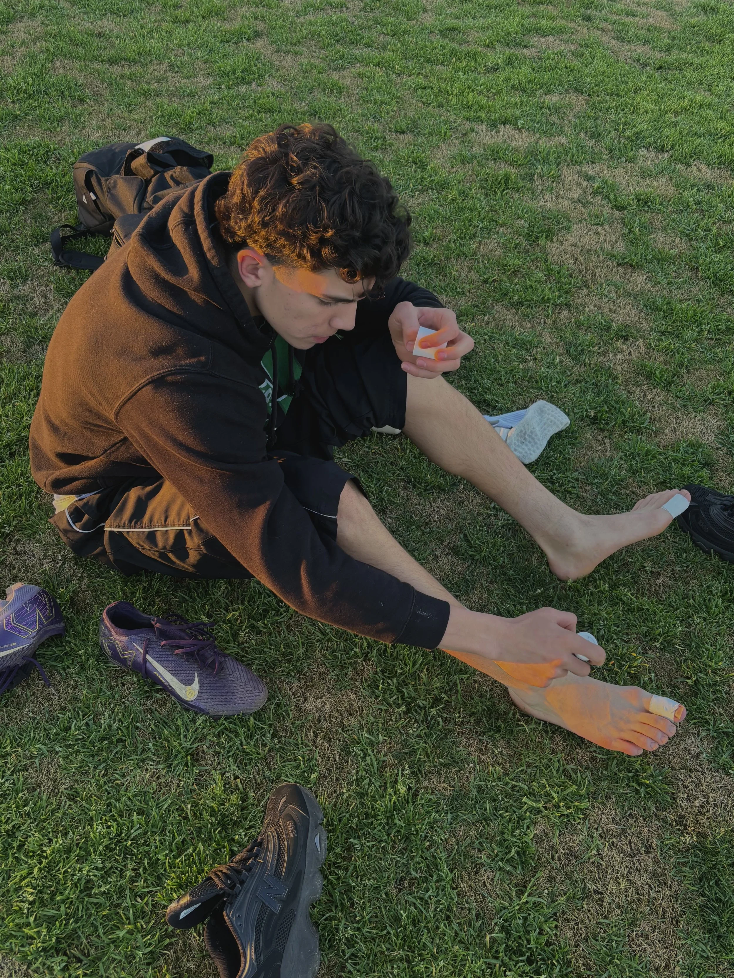  Mateo Esparza getting game ready applying ice hot on his feet and taping his toes before a game against Central Catholic, February 2, 2026. (Christian Ambriz/The Tower)&nbsp; 