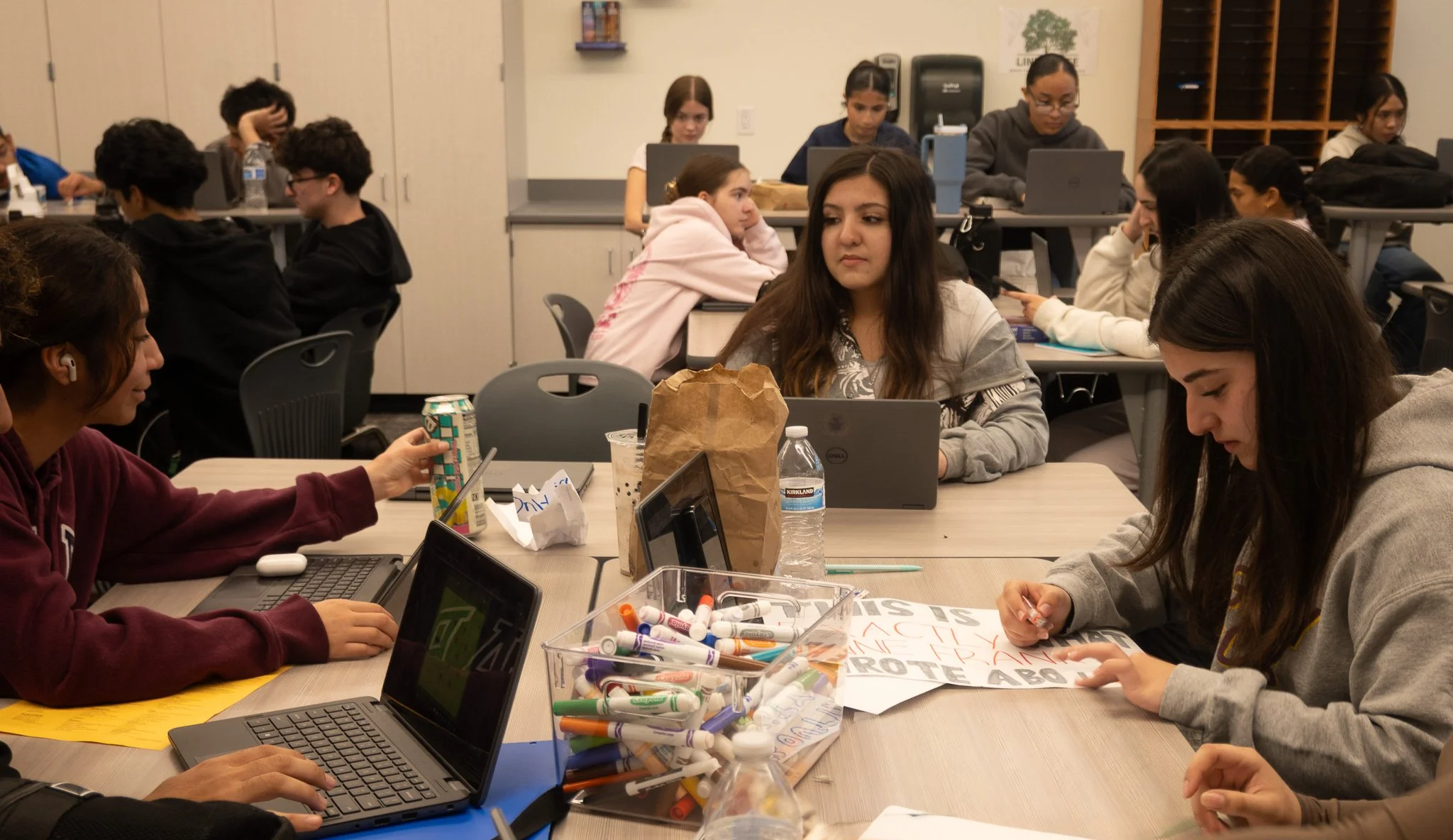 A tennis athlete works on her English honors assignment during class time. 