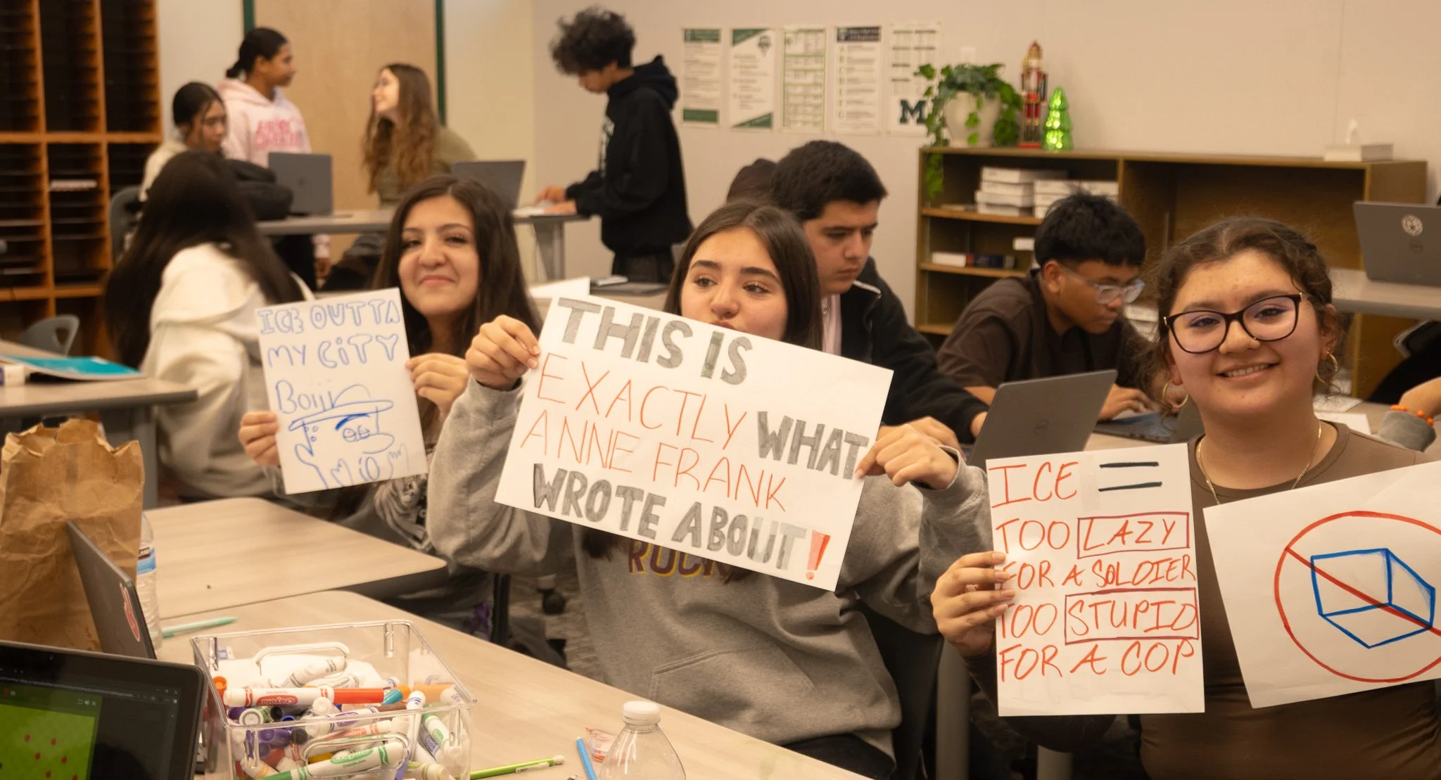 A tennis athlete works on her English honors assignment during class time. 