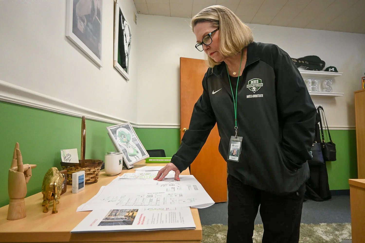  Principal Megan Peterson is standing in her office while&nbsp;overlooking some paperwork during the fall of 2022 in&nbsp;Manteca, California, at Manteca High. (Tower file photo)&nbsp; 