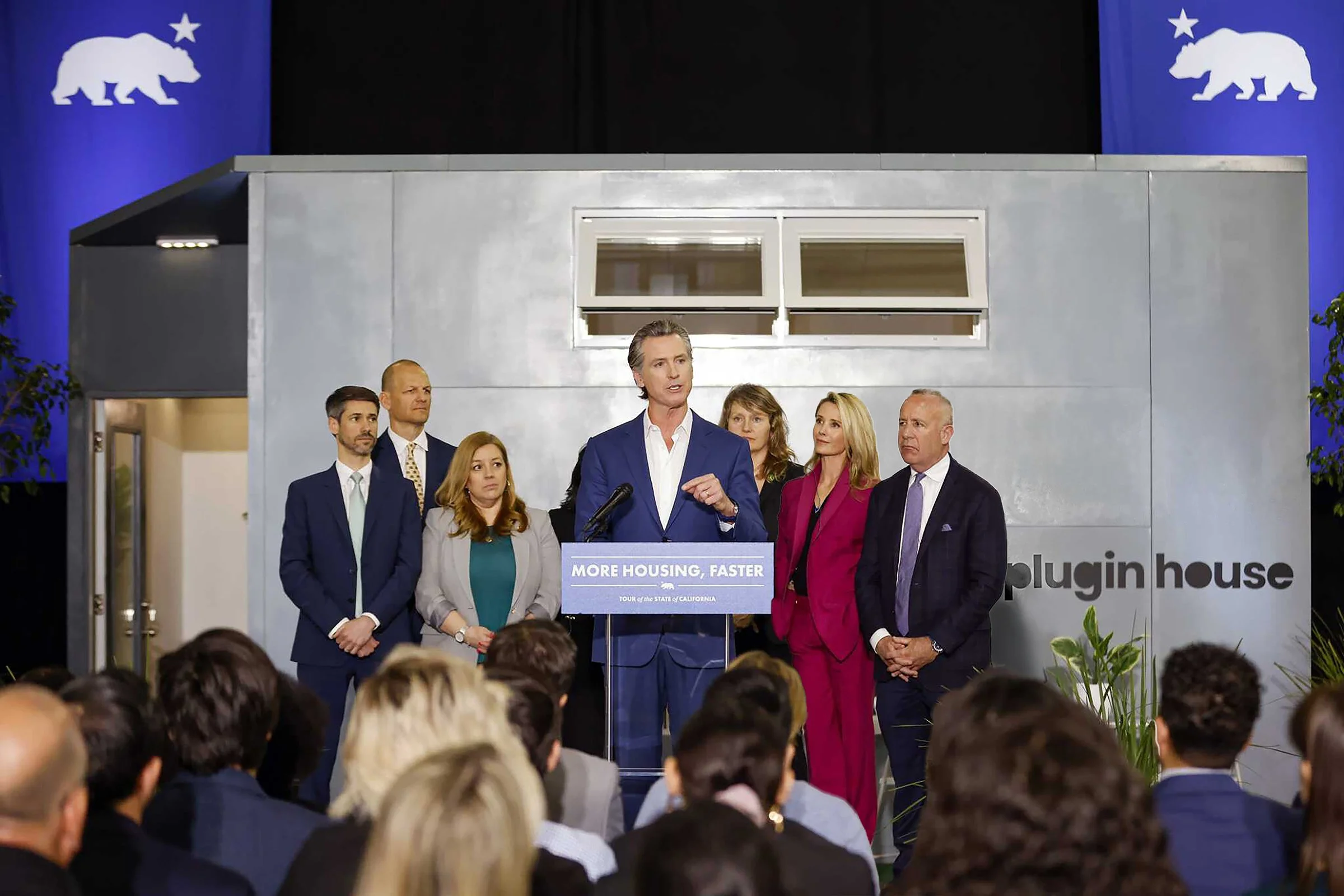 Newsom Speaking In Front of Plugin House_small.jpg