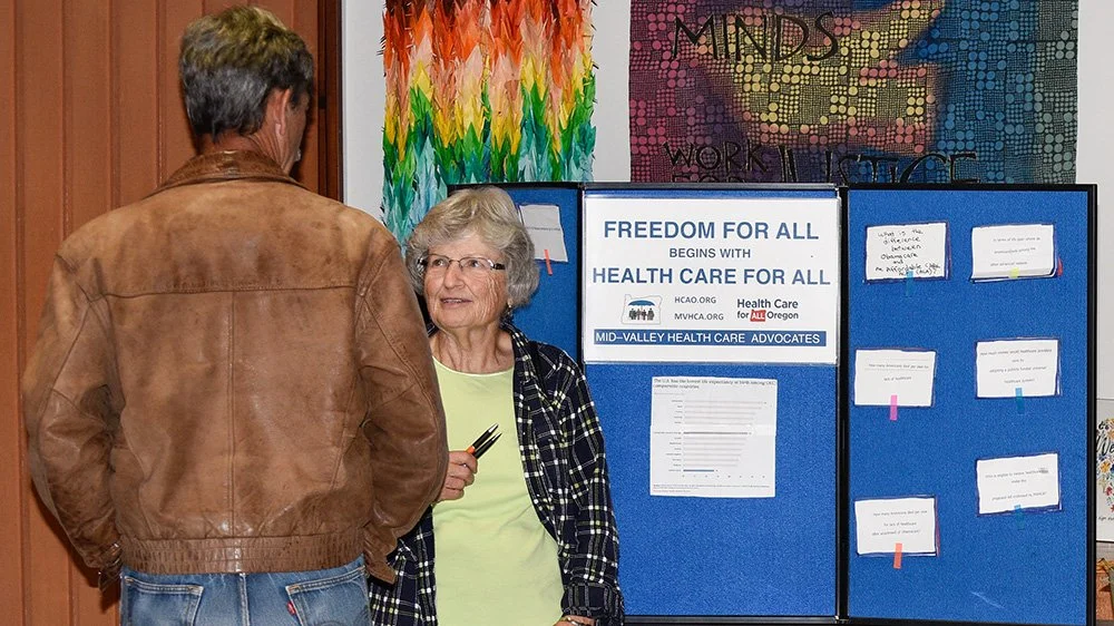 MVHCA volunteer chats with a citizen at a tabling event