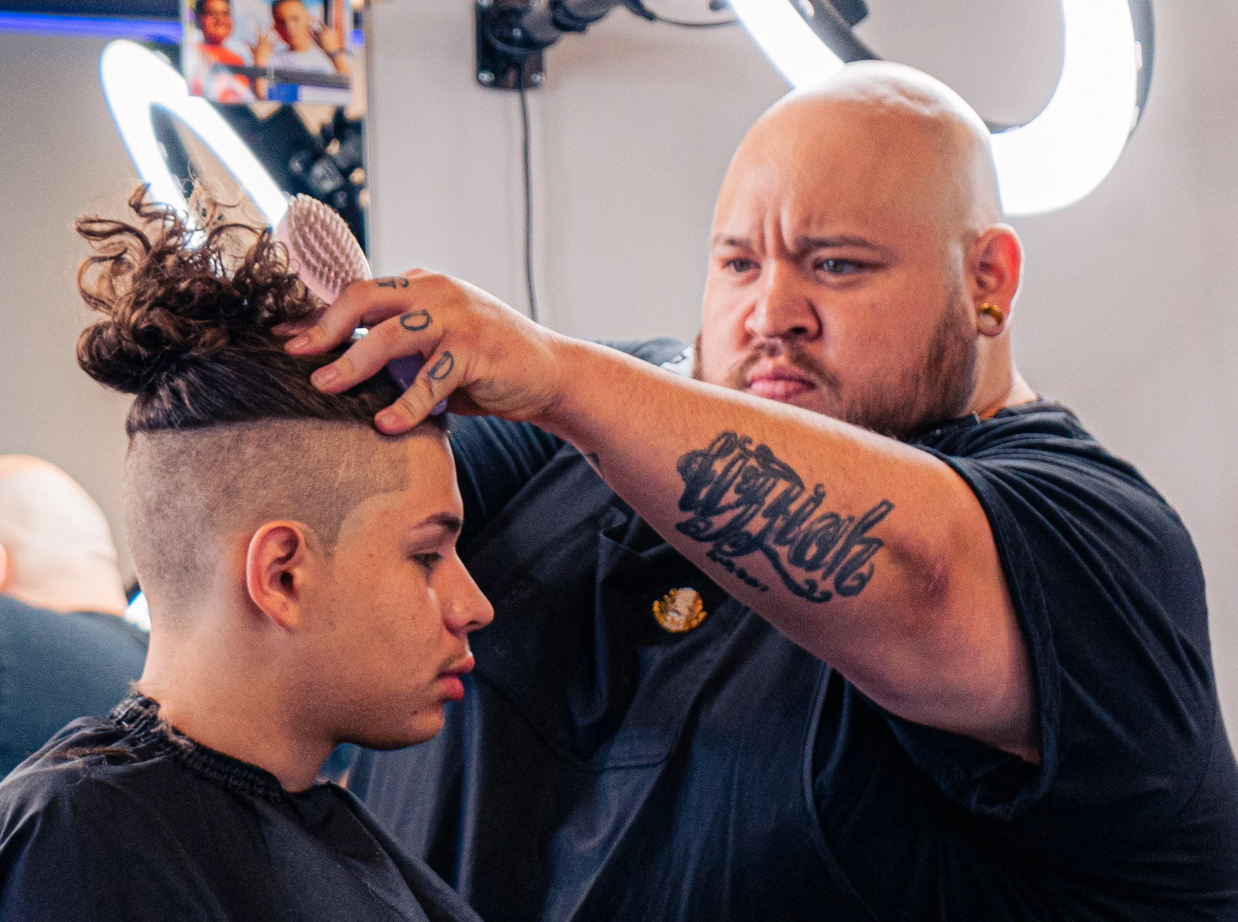 Harrisonburg Barber Fred cutting customers hair