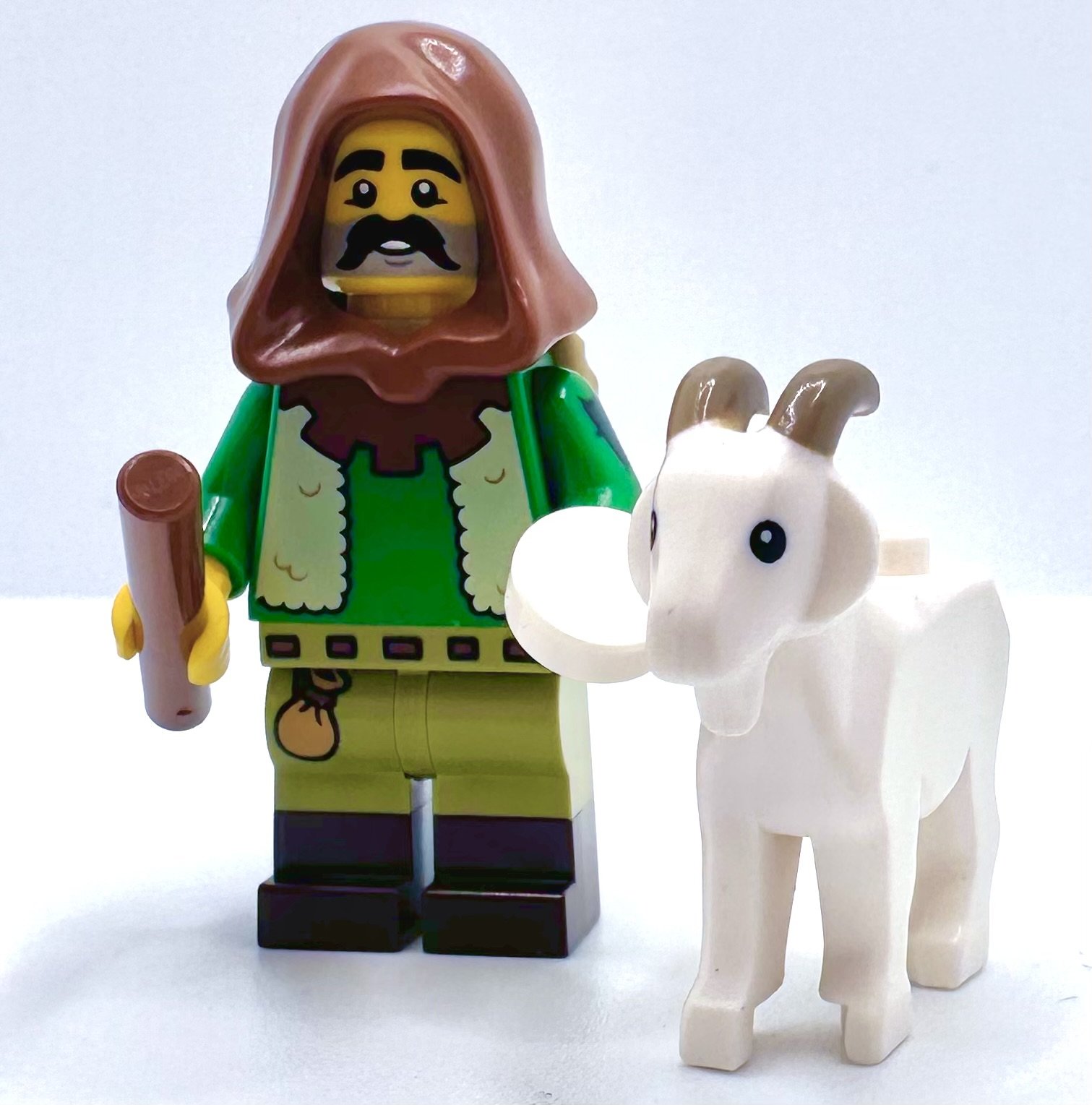 BuffaLUG Dives into the Fun: LEGO Collectible Minifigure Series 25 Review. Goat Herd: Honestly, it's not because of the Goat! His face print is wonderful with a mustache and a 5 o'clock shadow, the hood looks great in brown, and it fits right into Castle and (my fave) Forestmen.
