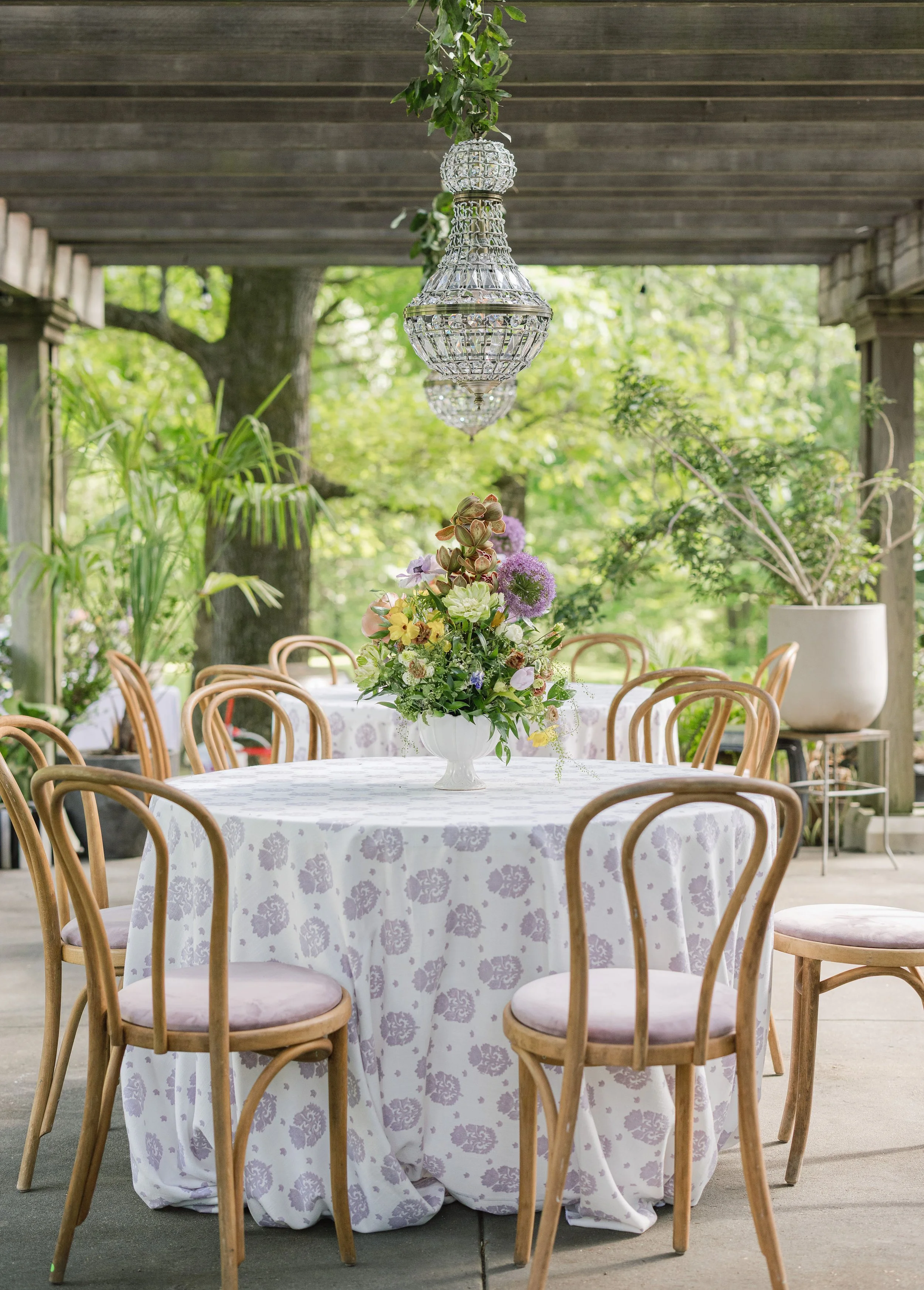 Luxury wedding reception design with natural wood dining chairs at Field and Forest in Mississippi. 