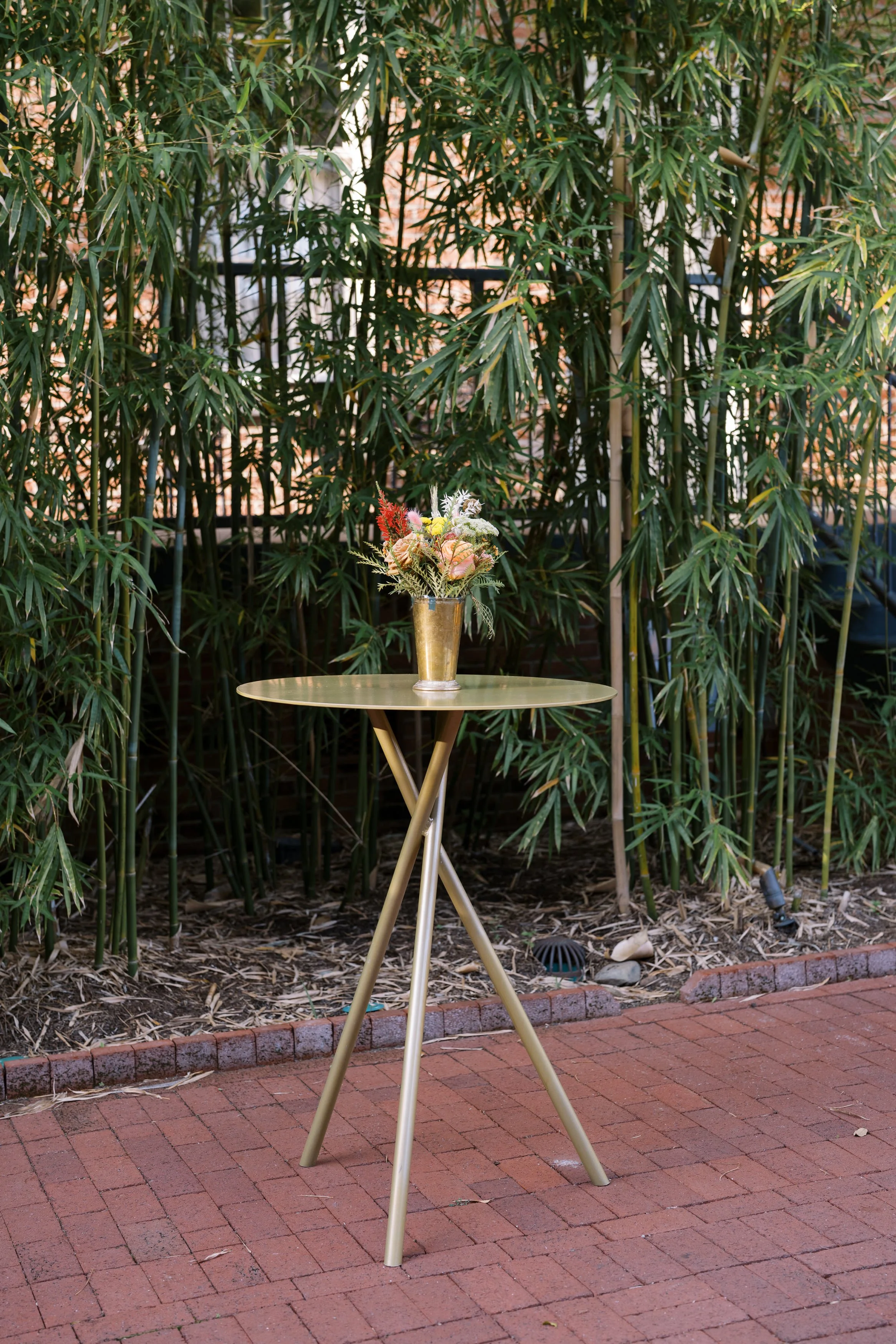 Wedding cocktail house with gold highboys at Hotel Saint Vincent in New Orleans.