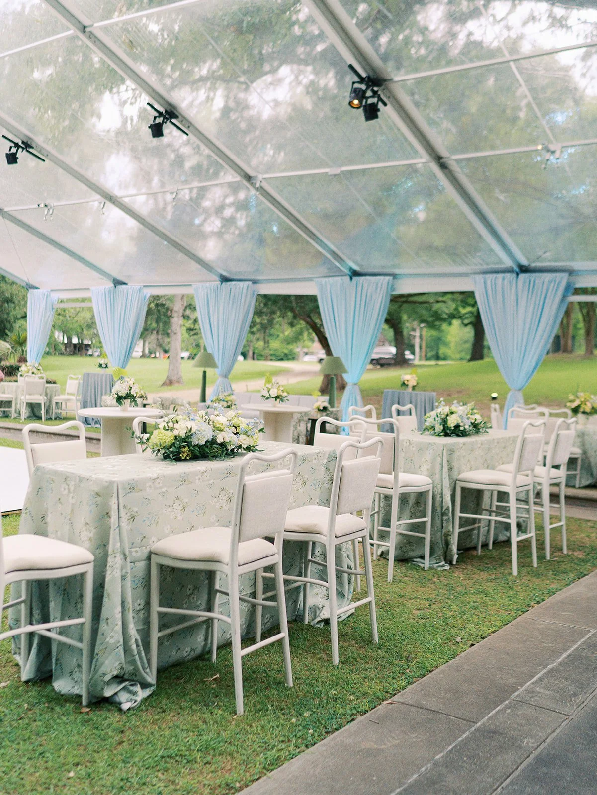 Luxury wedding reception design with white barstools at Field and Forest in Mississippi.